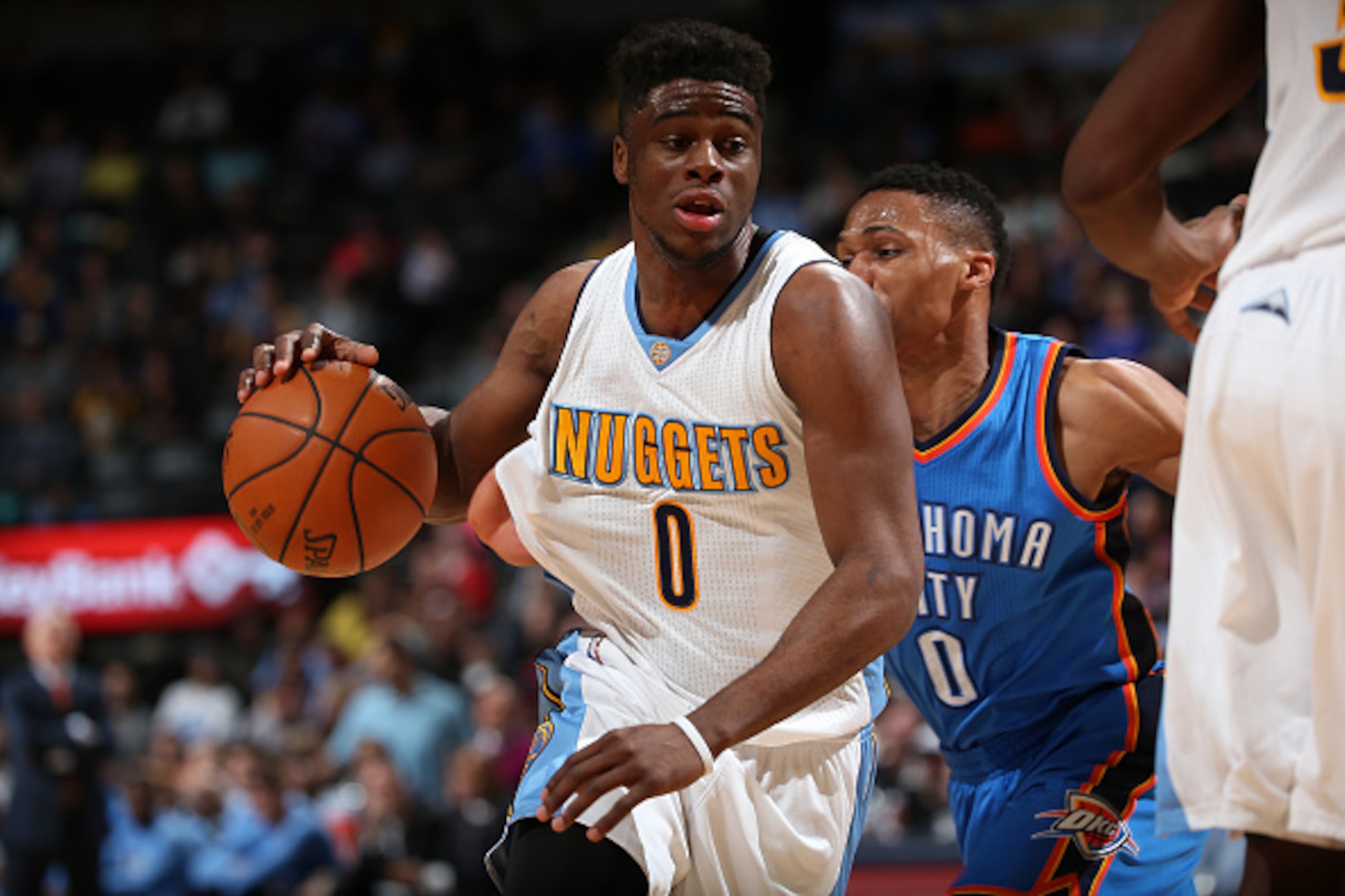 DENVER, CO - JANUARY 19:  Emmanuel Mudiay #0 of the Denver Nuggets controls the ball against Russell Westbrook #0 of the Oklahoma City Thunder at Pepsi Center on January 19, 2016 in Denver, Colorado. The Thunder defeated the Nuggets 110-104. NOTE TO USER: