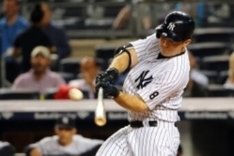 Sep 29, 2015; Bronx, NY, USA;  New York Yankees left fielder Dustin Ackley (29) hits a home run to right bringing in a runner to score during the first inning against the Boston Red Sox at Yankee Stadium. Mandatory Credit: Anthony Gruppuso-USA TODAY Sport