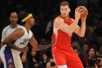 December 25, 2015; Los Angeles, CA, USA; Los Angeles Clippers forward Blake Griffin (32) moves the ball against Los Angeles Lakers forward Nick Young (0) during the second half of an NBA basketball game on Christmas at Staples Center. Mandatory Credit: Ga