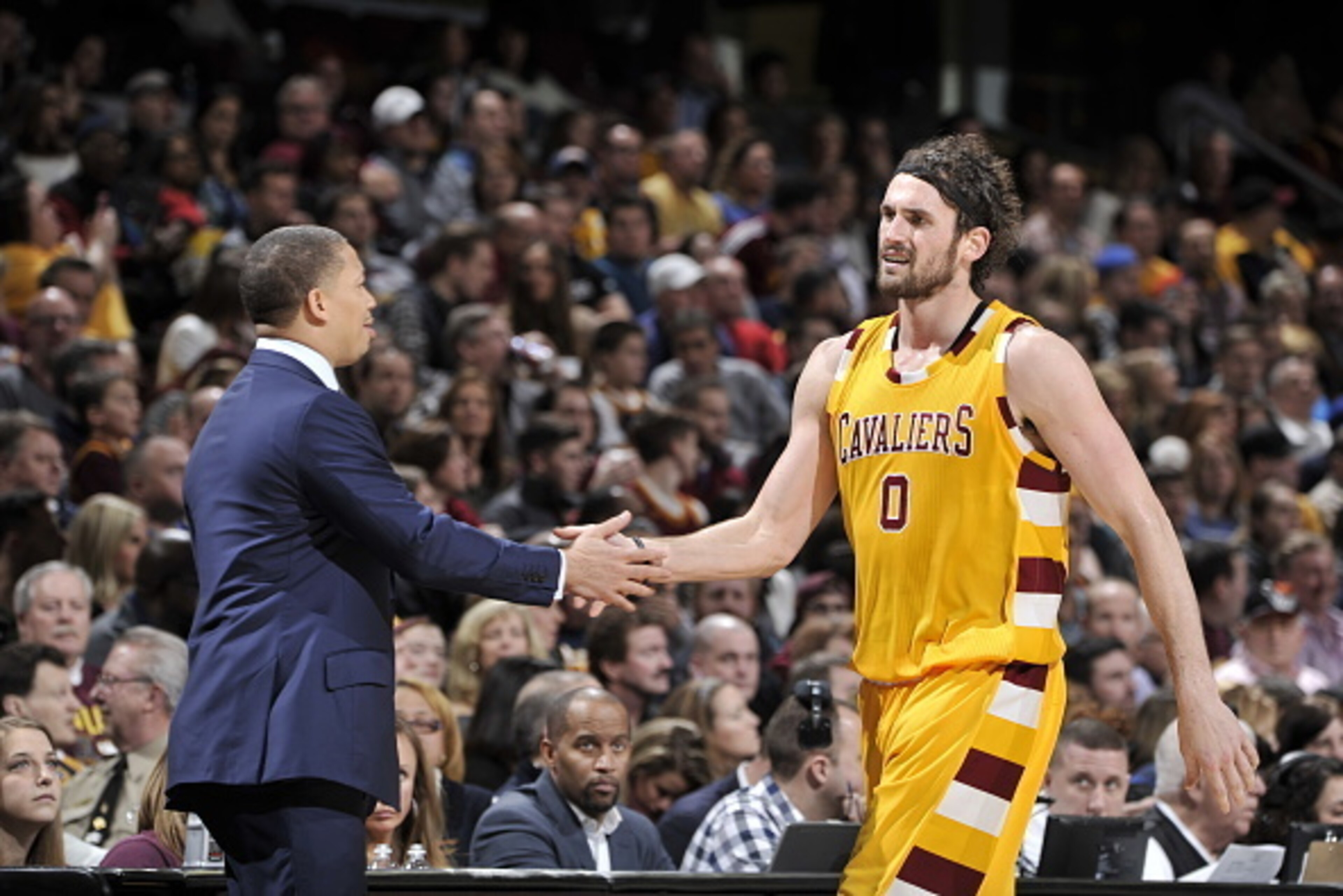 CLEVELAND, OH - JANUARY 30: Kevin Love #0 of the Cleveland Cavaliers high fives Head Coach Tyronn Lue during the game against the San Antonio Spurs on January 30, 2016 at Quicken Loans Arena in Cleveland, Ohio. NOTE TO USER: User expressly acknowledges a CLEVELAND, OH - JANUARY 30: Kevin Love #0 of the Cleveland Cavaliers high fives Head Coach Tyronn Lue during the game against the San Antonio Spurs on January 30, 2016 at Quicken Loans Arena in Cleveland, Ohio. NOTE TO USER: User expressly acknowledges a