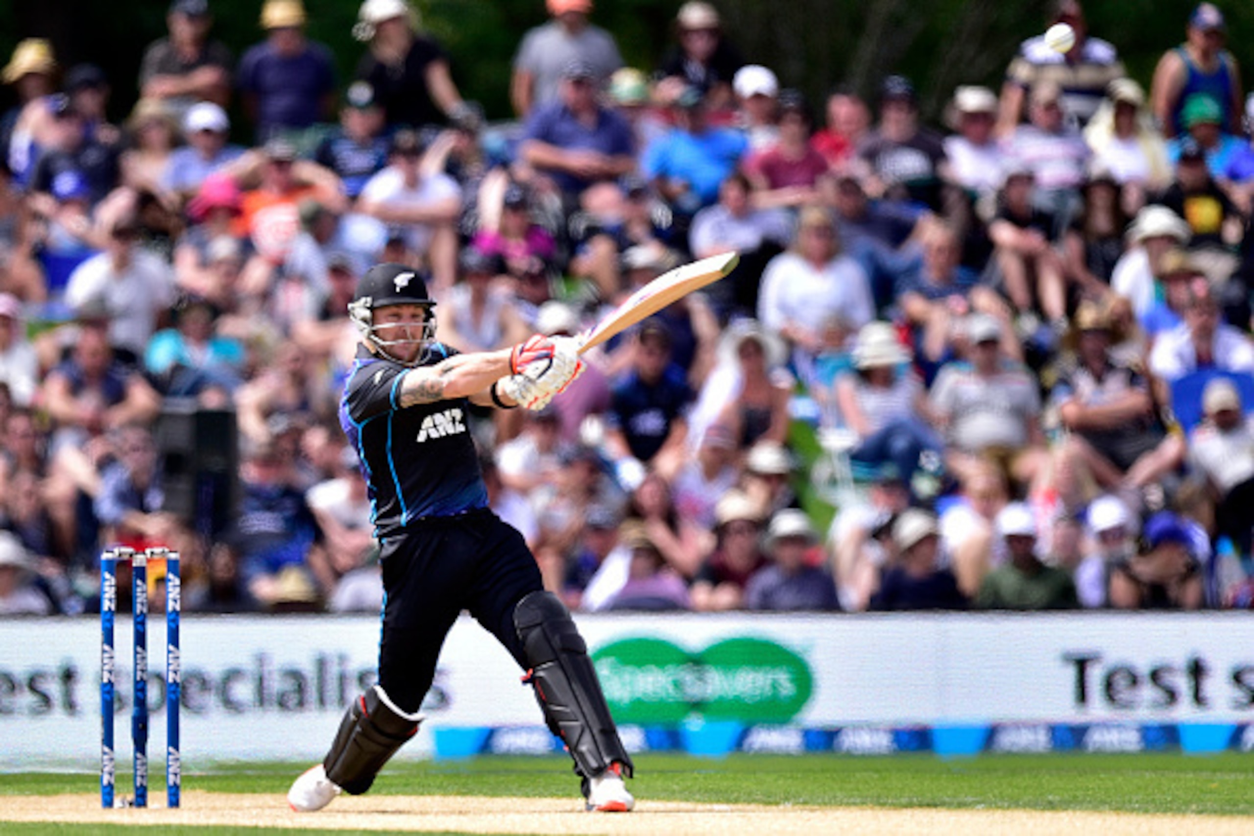 Brendon McCullum of New Zealand plays a shot during the first one-day international cricket match between New Zealand and Sri Lanka at Hagley Park in Christchurch on December 26, 2015.   AFP PHOTO / MARTY MELVILLE / AFP / Marty Melville        (Photo cred