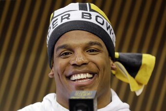 Cam Newton answering questions at media night
