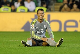 Real Madrid's Portuguese forward Cristiano Ronaldo smiles during the Spanish league football match Real Betis Balompie vs Real Madrid CF at the Benito Villamarin stadium in Sevilla on January 24, 2016.The match ended in a draw 1-1.  AFP PHOTO / CRISTINA Q