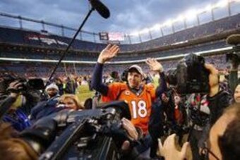 Jan 24, 2016; Denver, CO, USA; Denver Broncos quarterback Peyton Manning (18) waves to the crowd after defeating the New England Patriots in the AFC Championship football game at Sports Authority Field at Mile High. Mandatory Credit: Kevin Jairaj-USA TODA