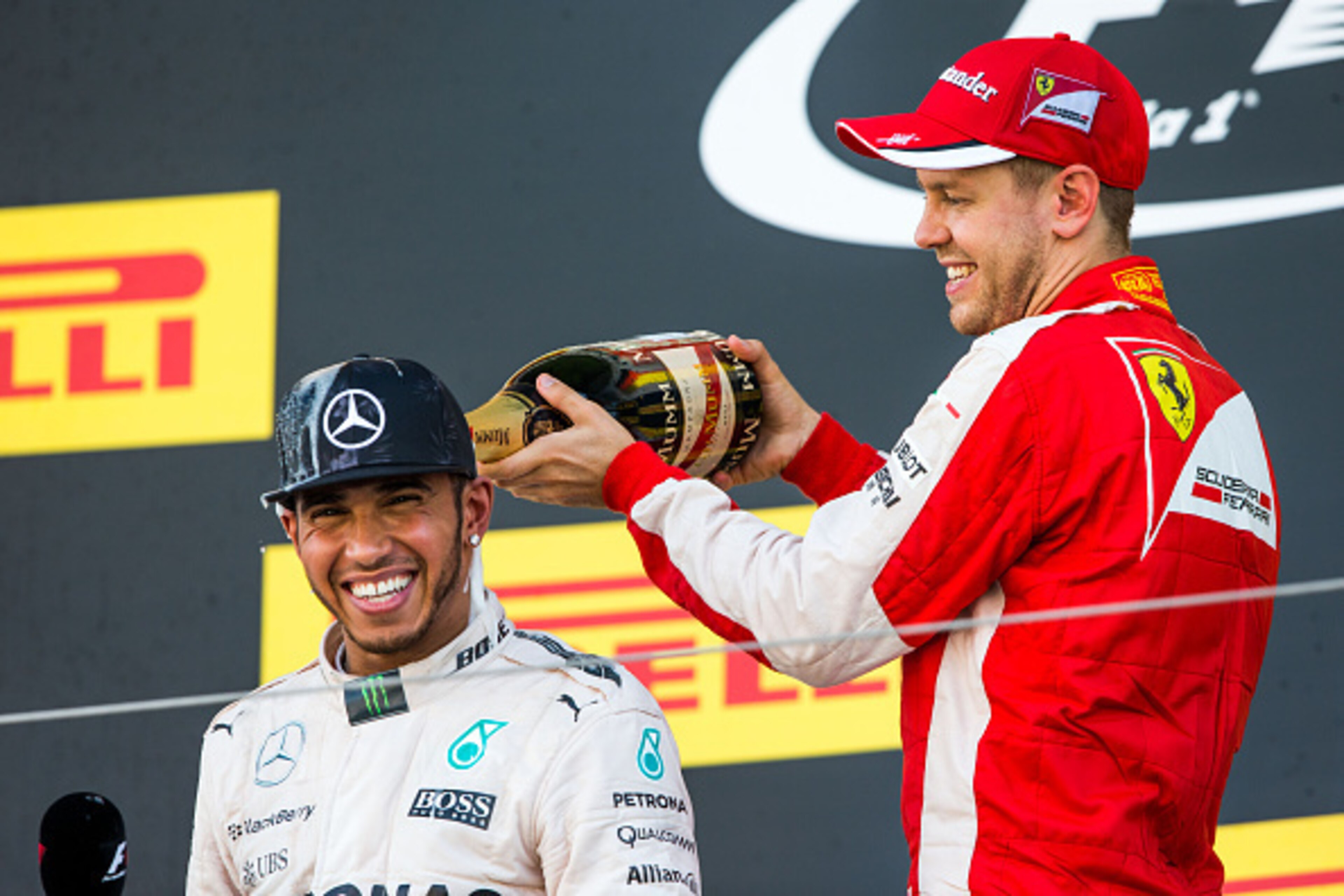 SUZUKA, JAPAN - SEPTEMBER 27:  Lewis Hamilton of Mercedes and Great Britain with Sebastian Vettel of Ferrari and Germany during the Formula One Grand Prix of Japan at Suzuka Circuit on September 27, 2015 in Suzuka.  (Photo by Peter J Fox/Getty Images)