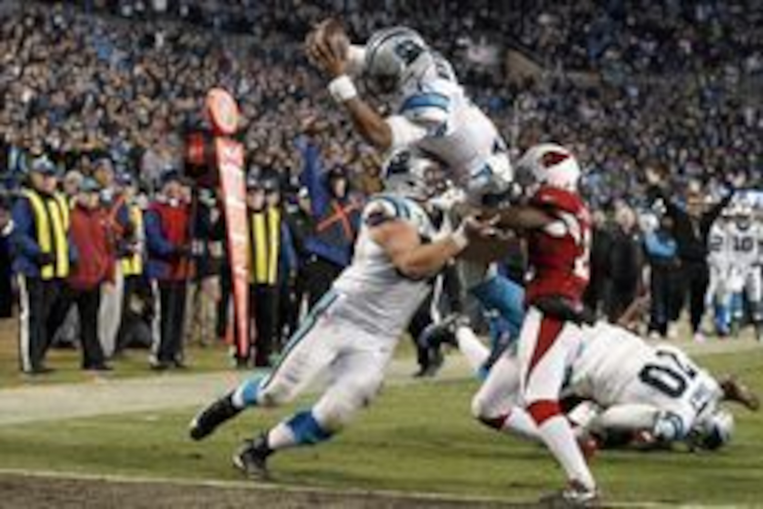 Jan 24, 2016; Charlotte, NC, USA; Carolina Panthers quarterback Cam Newton (1) dives for a touchdown during the third quarter against the Arizona Cardinals in the NFC Championship football game at Bank of America Stadium. Mandatory Credit: Jeremy Brevard-