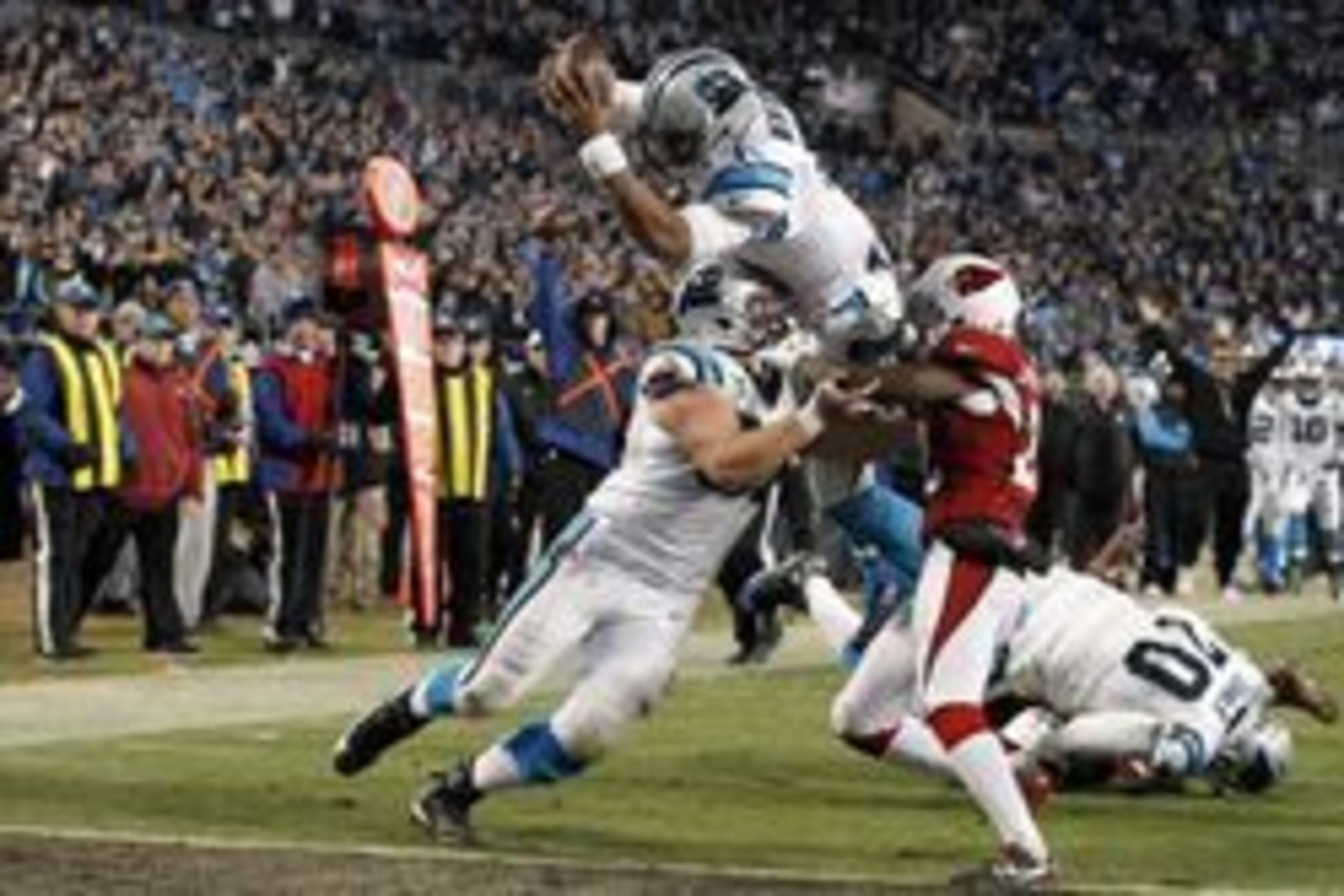 Jan 24, 2016; Charlotte, NC, USA; Carolina Panthers quarterback Cam Newton (1) dives for a touchdown during the third quarter against the Arizona Cardinals in the NFC Championship football game at Bank of America Stadium. Mandatory Credit: Jeremy Brevard-