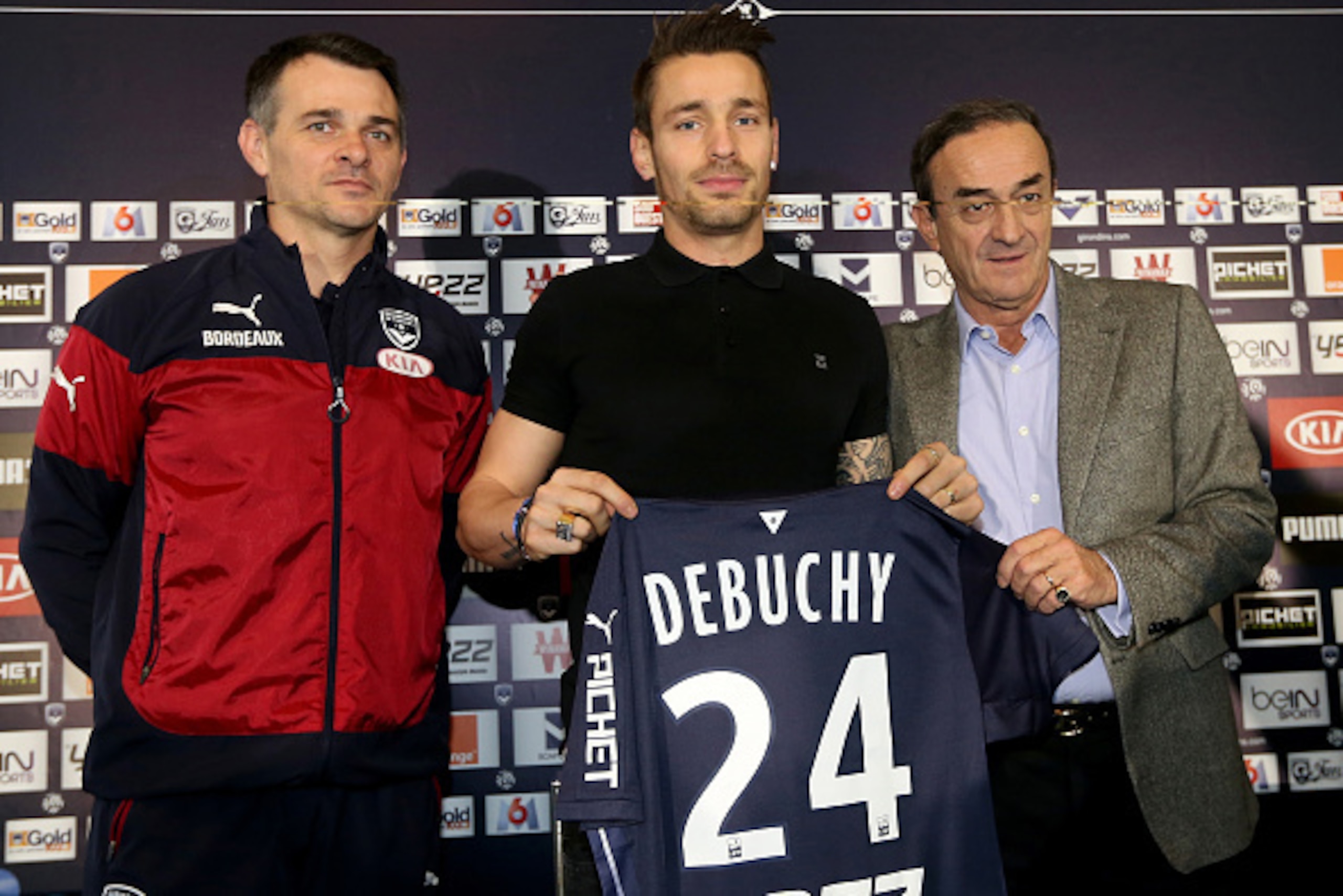 BORDEAUX, FRANCE - FEBRUARY 02:   (L to R) Bordeaux's head coach Willy Sagnol poses with new loan signing Mathieu Debuchy and Girondins de Bordeaux's president Jean Louis Triaud after a press conference at Bordeaux's training ground, Chateau du Haillan on