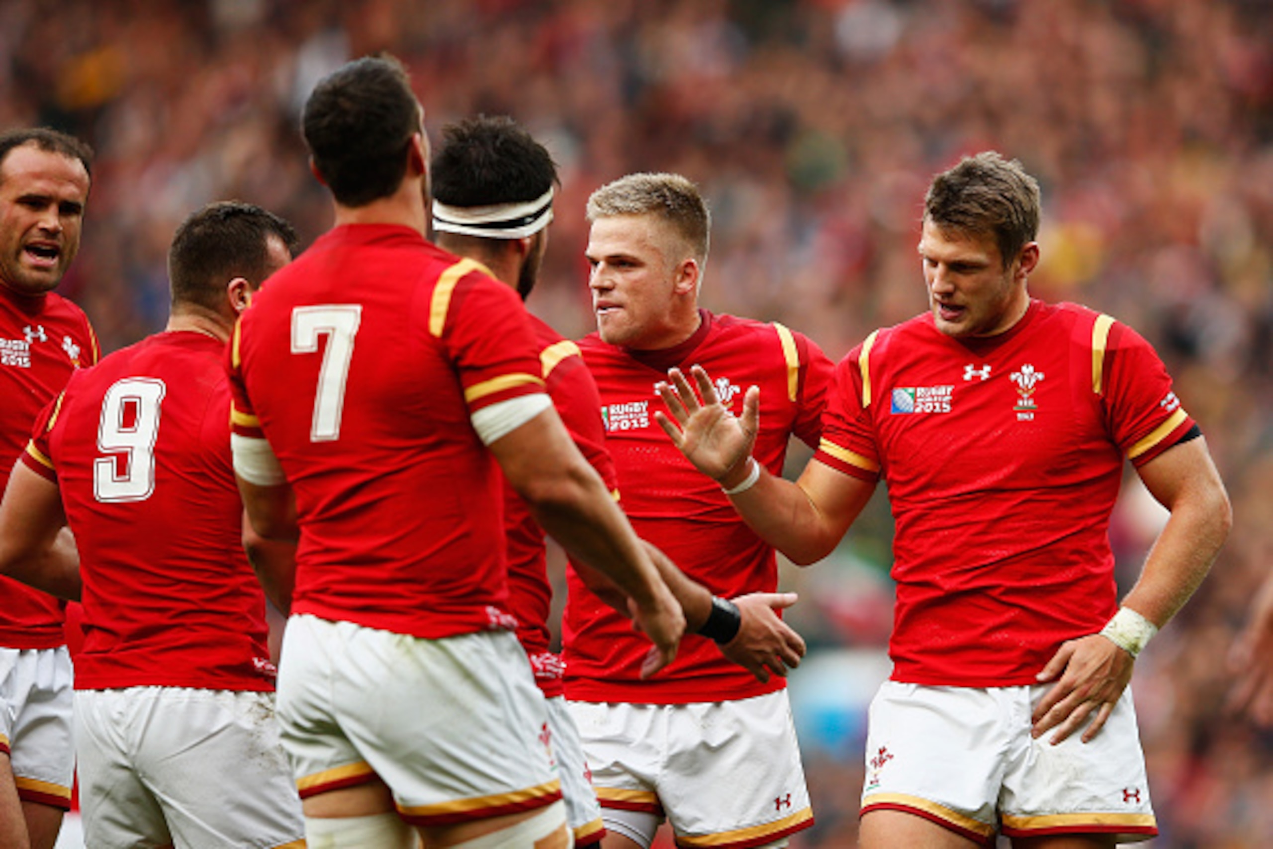 LONDON, ENGLAND - OCTOBER 17:  Dan Biggar of Wales is congratulated by his team mates for his role in the opening try during the 2015 Rugby World Cup Quarter Final match between South Africa and Wales at Twickenham Stadium on October 17, 2015 in London, U