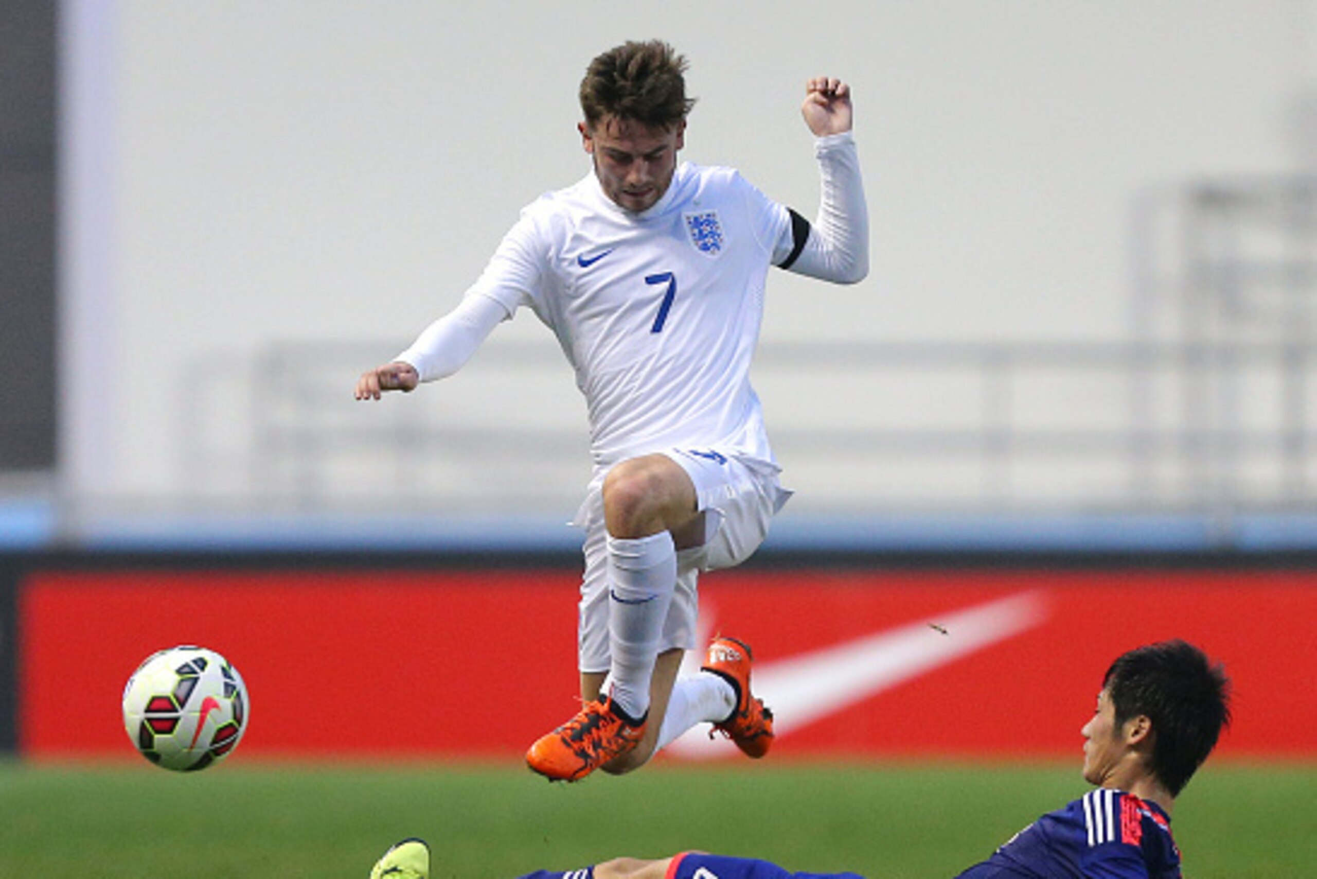 MANCHESTER, ENGLAND - NOVEMBER 15: Patrick Roberts of England is tackled by Reiya Morishita of Japan during the U19 International friendly match between England and Japan at Manchester City Academy Stadium on November 15, 2015 in Manchester, England. (Pho MANCHESTER, ENGLAND - NOVEMBER 15: Patrick Roberts of England is tackled by Reiya Morishita of Japan during the U19 International friendly match between England and Japan at Manchester City Academy Stadium on November 15, 2015 in Manchester, England. (Pho