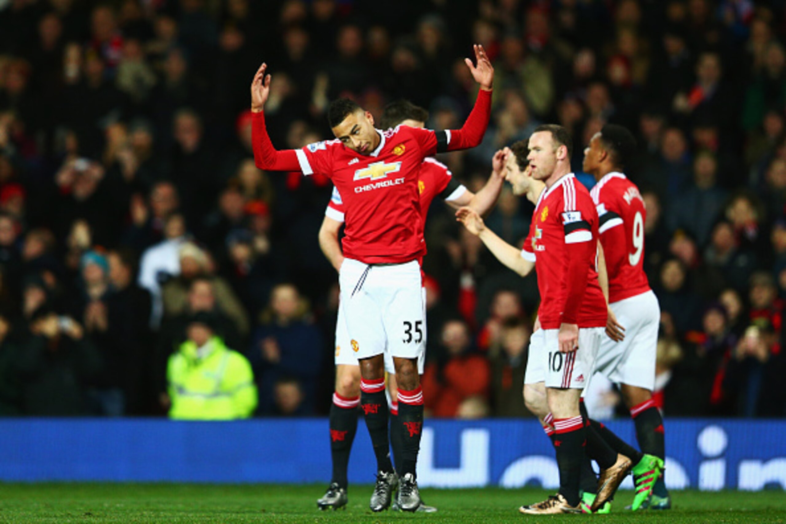 MANCHESTER, ENGLAND - FEBRUARY 02:  Jesse Lingard (L) of Manchester United celebrates scoring his team's first goal with his team mates during the Barclays Premier League match between Manchester United and Stoke City at Old Trafford on February 2, 2016 i