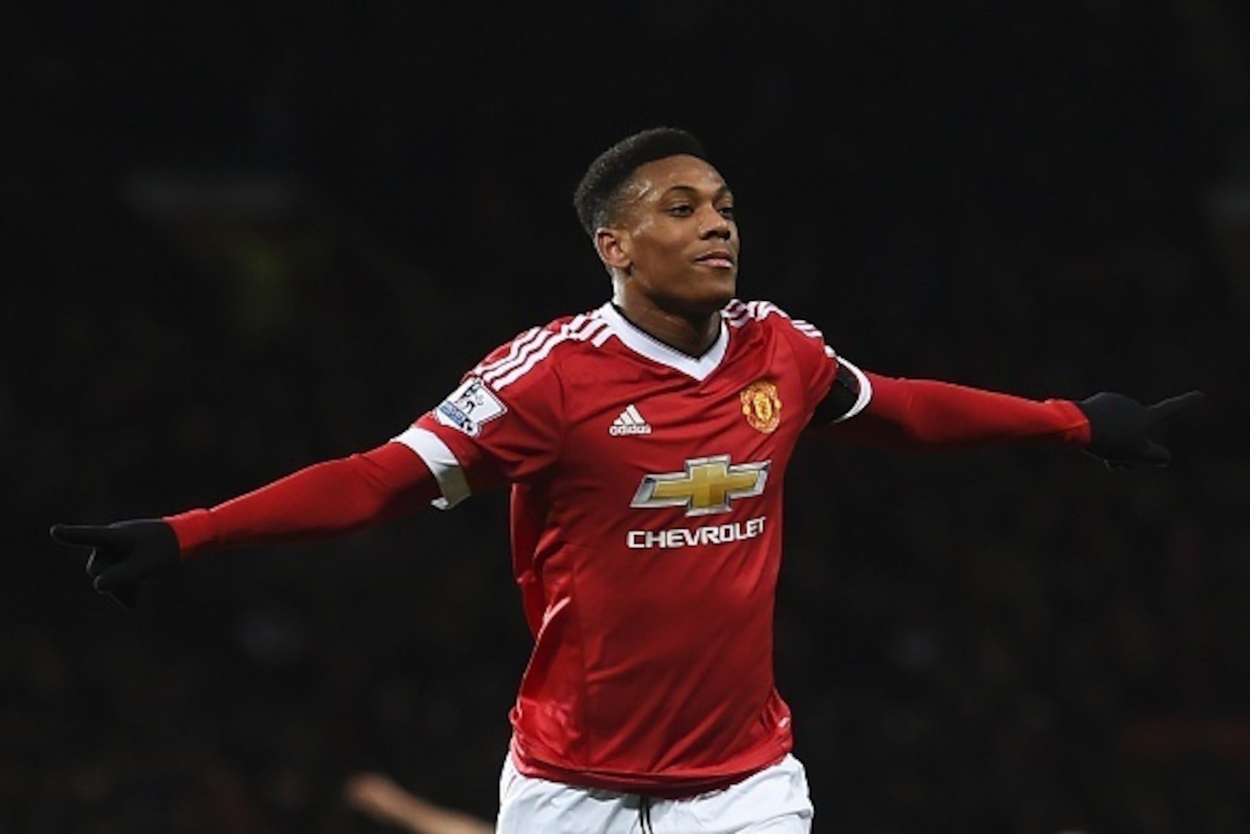 Manchester United's French striker Anthony Martial celebrates scoring their second goal during the English Premier League football match between Manchester United and Stoke City at Old Trafford in Manchester, north west England, on February 2, 2016. / AFP