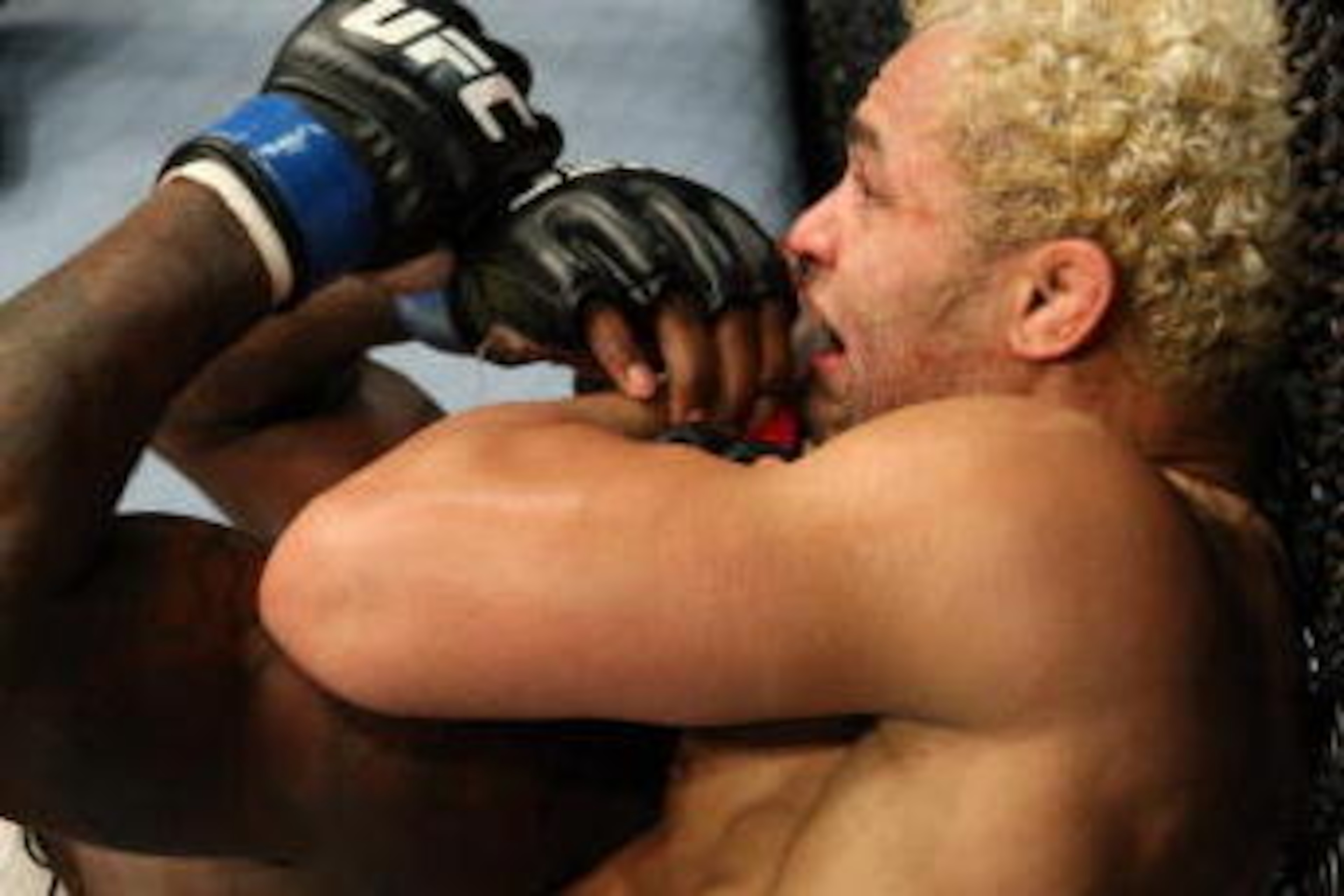 LAS VEGAS - NOVEMBER 21:  Josh Koscheck (white shorts) def. Anthony Johnson (red shorts) - Submission (rear naked choke) - 4:47 round 2 during UFC 106 at Mandalay Bay Events Center on November 21, 2009 in Las Vegas, Nevada. (Photo by Josh Hedges/Zuffa LLC