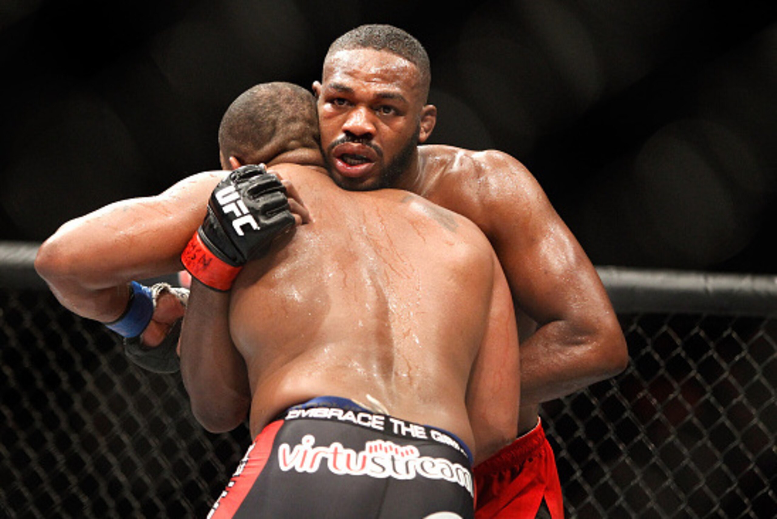 LAS VEGAS, NV - JANUARY 03:  Light heavyweight champion Jon Jones (R) grapples with Daniel Comier during the UFC 182 event at the MGM Grand Garden Arena on January 3, 2015 in Las Vegas, Nevada. Jones retained his title by unanimous decision.  (Photo by St