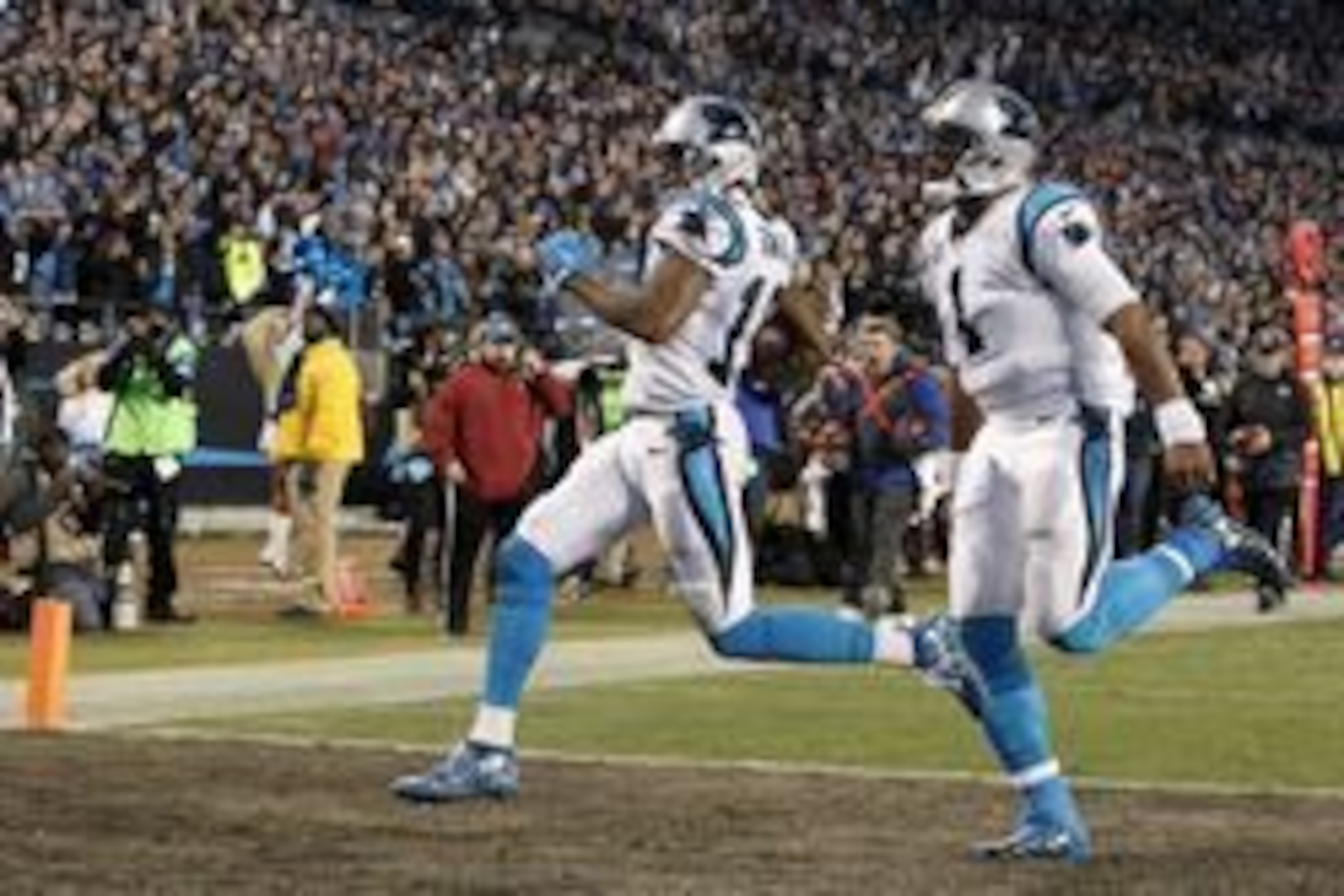Jan 24, 2016; Charlotte, NC, USA; Carolina Panthers wide receiver Ted Ginn (19) scores a touchdown during the first quarter against the Arizona Cardinals in the NFC Championship football game at Bank of America Stadium. Mandatory Credit: Jeremy Brevard-US