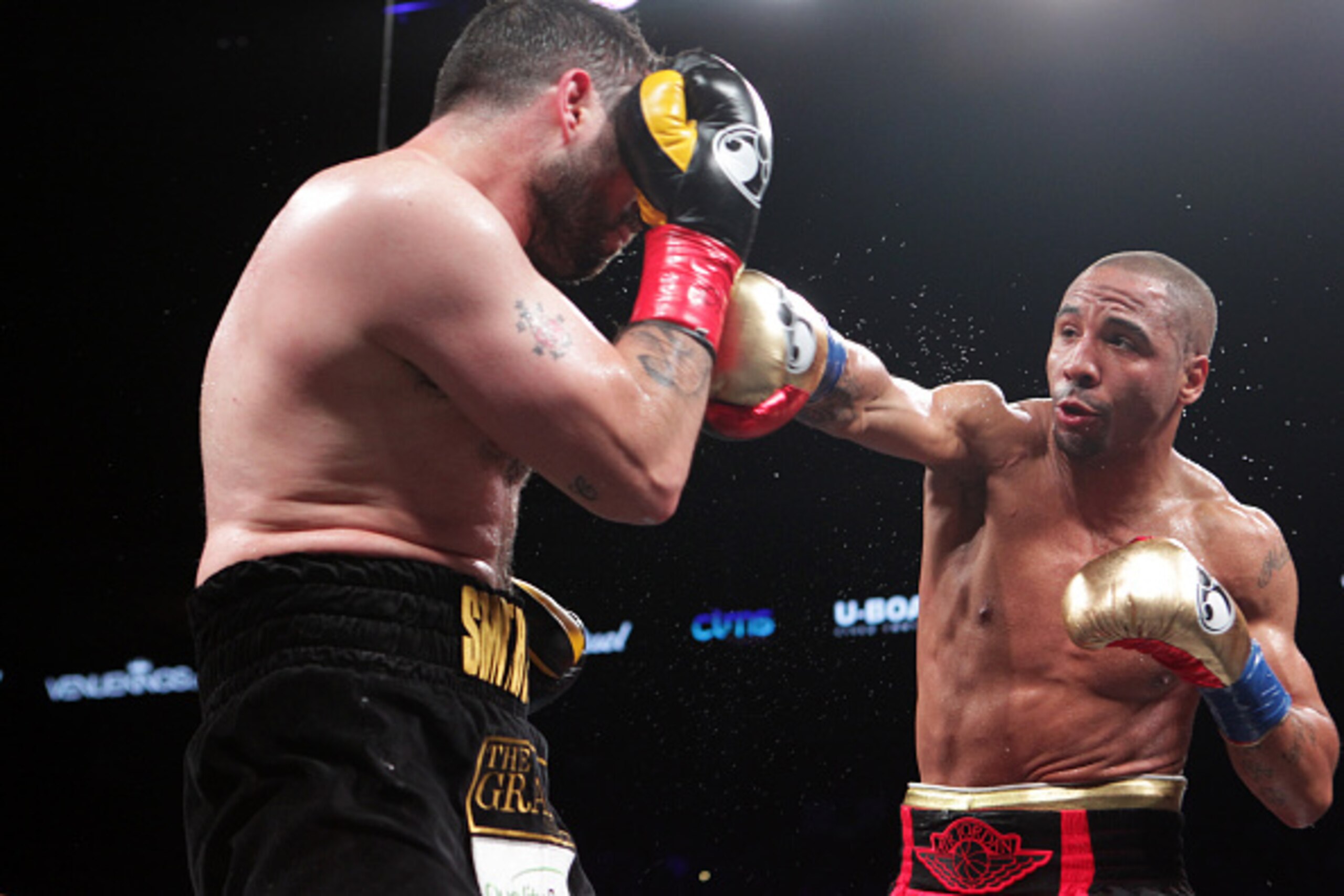 OAKLAND, CA - JUNE 20: Andre Ward (R) throws a right hook against Paul Smith during their Cruiserweight fight at ORACLE Arena on June 20, 2015 in Oakland, California. (Photo by Alexis Cuarezma/Getty Images)