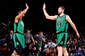 NEW YORK, NY - FEBRUARY 2: Evan Turner #11 high fives teammate Tyler Zeller #44 of the Boston Celtics during the game on February 2, 2016 at Madison Square Garden in New York, New York. NOTE TO USER: User expressly acknowledges and agrees that, by downloa
