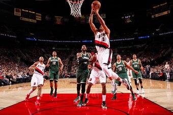 PORTLAND, OR - FEBRUARY 2: C.J. McCollum #3 of the Portland Trail Blazers goes for the lay up against the Milwaukee Bucks during the game on February 2, 2016 at Moda Center in Portland,Oregon. NOTE TO USER: User expressly acknowledges and agrees that, by 