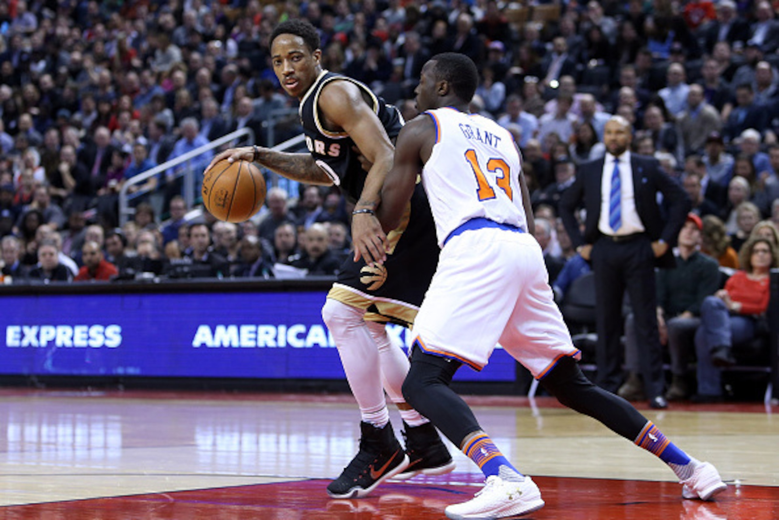 TORONTO, ON - JANUARY 28: DeMar DeRozan #10 of the Toronto Raptors shoots the ball as Jerian Grant #13 of the New York Knicks defends during an NBA game at the Air Canada Centre on January 28, 2016 in Toronto, Ontario, Canada. NOTE TO USER: User express TORONTO, ON - JANUARY 28: DeMar DeRozan #10 of the Toronto Raptors shoots the ball as Jerian Grant #13 of the New York Knicks defends during an NBA game at the Air Canada Centre on January 28, 2016 in Toronto, Ontario, Canada. NOTE TO USER: User express