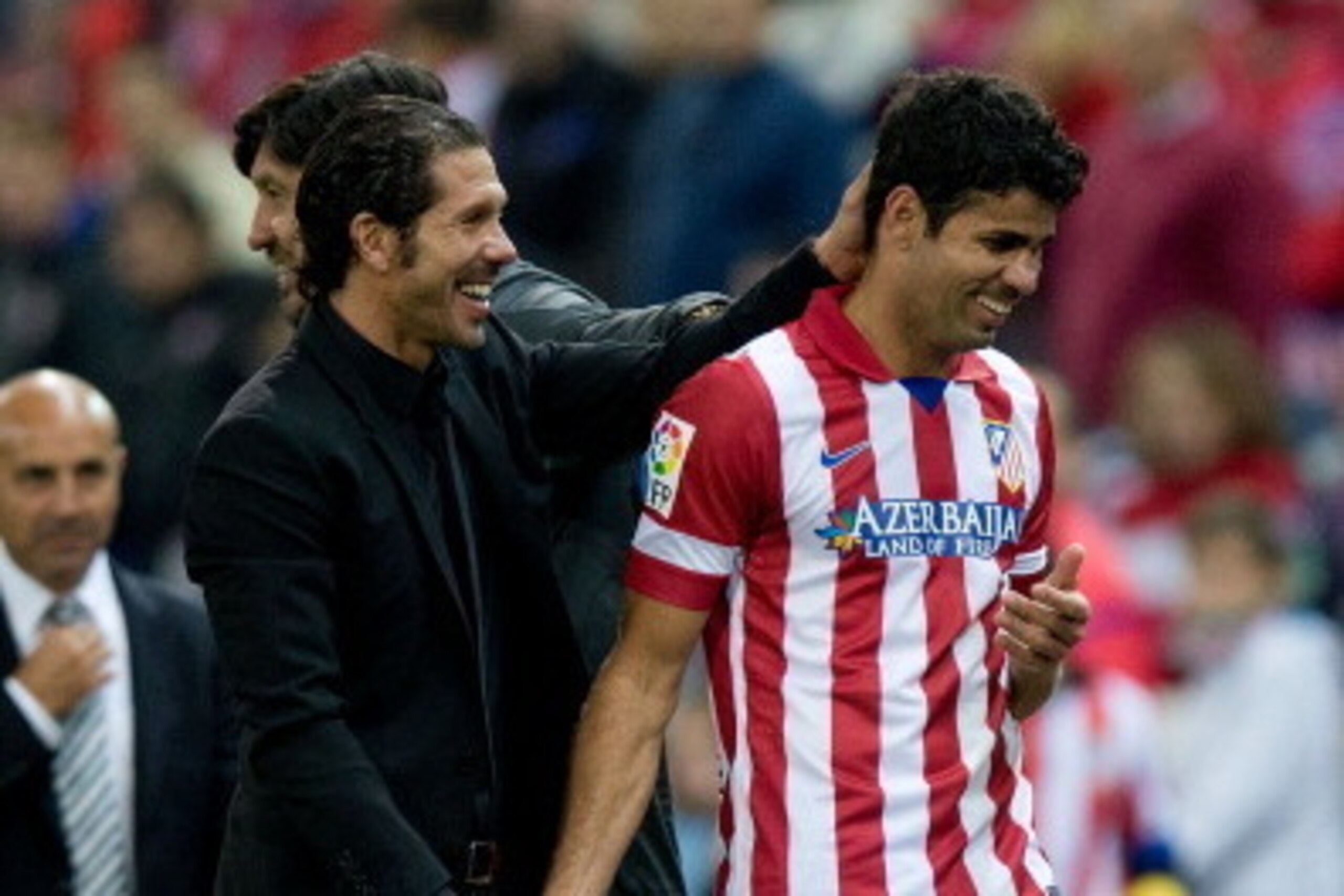 MADRID, SPAIN - OCTOBER 27: Head coach Diego Simeone of Atletico de Madrid congratulates goal-scorer Diego Costa during the La Liga match between Club Atletico de Madrid and Real Betis Balompieat at Vicente Calderon Stadium on October 27, 2013 in Madrid, MADRID, SPAIN - OCTOBER 27: Head coach Diego Simeone of Atletico de Madrid congratulates goal-scorer Diego Costa during the La Liga match between Club Atletico de Madrid and Real Betis Balompieat at Vicente Calderon Stadium on October 27, 2013 in Madrid,