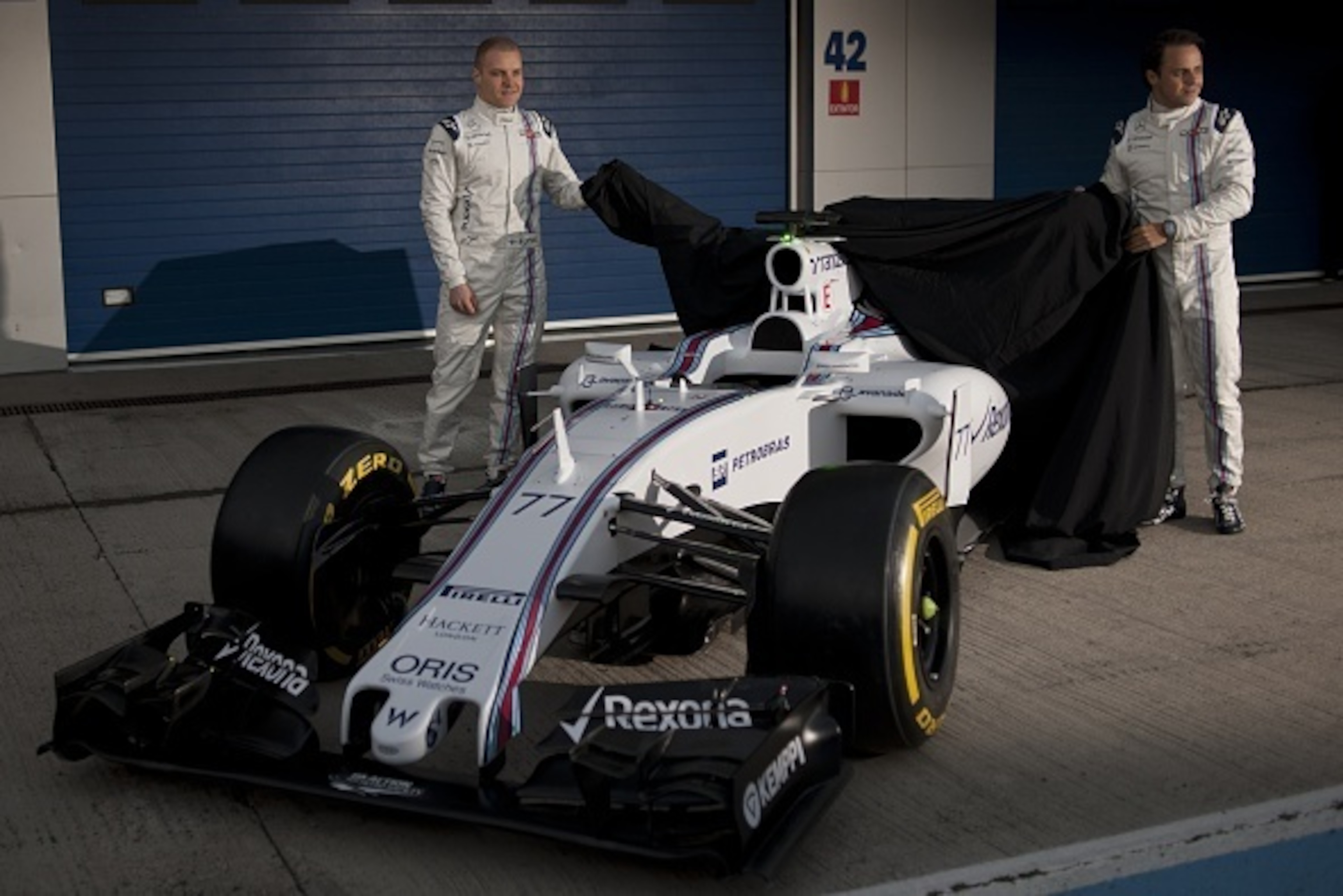 Williams Martini Racing's Brazilian driver Felipe Massa (R) and Williams Martini Racing's Finnish driver Valtteri Bottas pose during the unveiling thier car  on the first day of the Formula One pre-season tests at Jerez racetrack in Jerez on February 1, 2