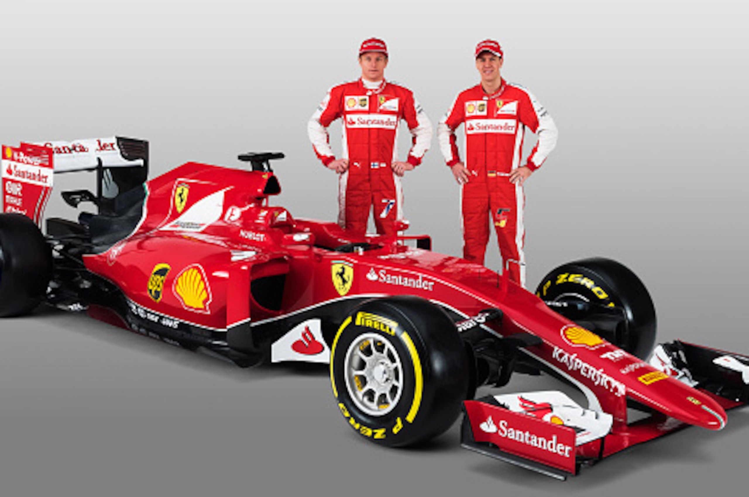 MARANELLO, ITALY - JANUARY 30:  (L-R) In this handout supplied by Scuderia Ferrari, Kimi Raikkonen and Sebastian Vettel attend the unveiling of their new SF15-T Formula One car on January 30, 2015 in Maranello, Italy. (Photo by Scuderia Ferrari via Getty 