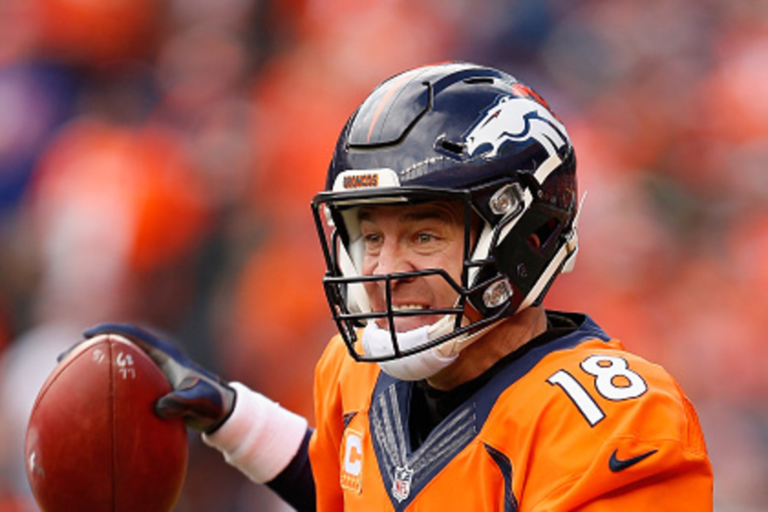 DENVER, CO - JANUARY 24:  Quarterback Peyton Manning #18 of the Denver Broncos looks to pass during the AFC Championship game against the New England Patriots at Sports Authority Field at Mile High on January 24, 2016 in Denver, Colorado. The Broncos defe
