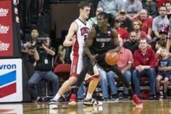 Jan 30, 2016; Las Vegas, NV, USA; San Diego State Aztecs forward Angelo Chol (3) is defended by UNLV Rebels forward Stephen Zimmerman Jr. (33) during the first half at Thomas & Mack Center. Mandatory Credit: Joshua Dahl-USA TODAY Sports