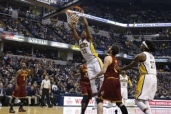 Feb 1, 2016; Indianapolis, IN, USA; Indiana Pacers center Myles Turner (27) dunks the ball past Cleveland Cavaliers forward Kevin Love (0) during the first half at Bankers Life Fieldhouse. Mandatory Credit: Brian Spurlock-USA TODAY Sports