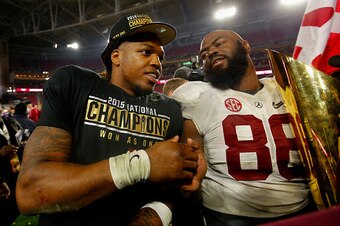 GLENDALE, AZ - JANUARY 11:  Derrick Henry #2 and A'Shawn Robinson #86 of the Alabama Crimson Tide celebrate after defeating the Clemson Tigers in the 2016 College Football Playoff National Championship Game at University of Phoenix Stadium on January 11, 