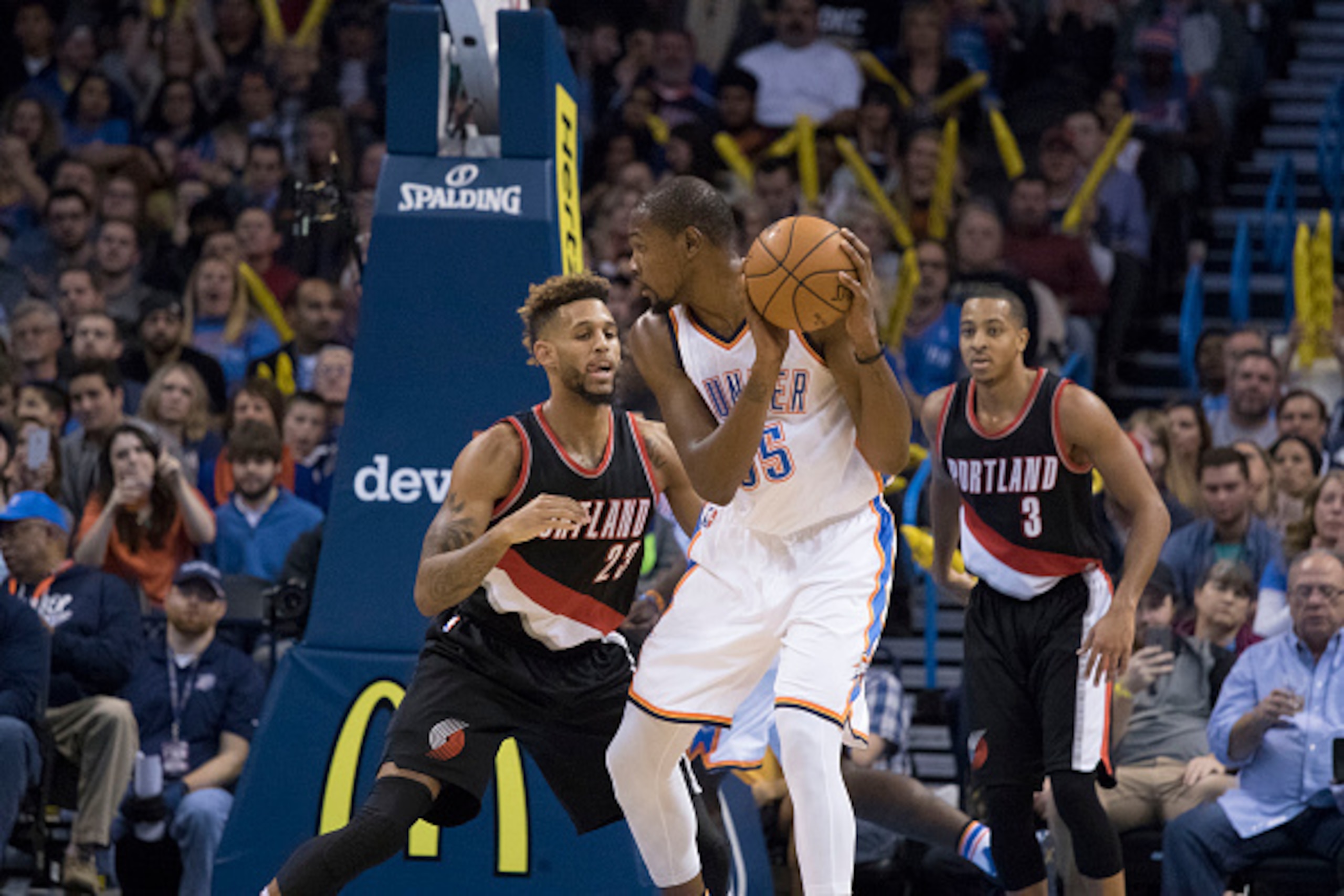 OKLAHOMA CITY, OK - DECEMBER 16:   Allen Crabbe #23 of the Portland Trail Blazers applies pressure to Kevin Durant #35 of the Oklahoma City Thunder during the third period a NBA game at the Chesapeake Energy Arena on December 16, 2015 in Oklahoma City, Ok