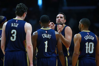 LOS ANGELES, CA - JANUARY 10:  Ryan Anderson #33 of the New Orleans Pelicans talks to teammates Omer Asik #3, Tyreke Evans #1 and Eric Gordon #10 during a break in NBA game action against the Los Angeles Clippers at Staples Center on January 10, 2016 in L