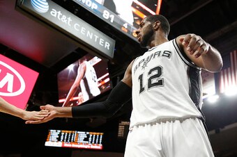 SAN ANTONIO,TX - FEBRUARY 3: LaMarcus Aldridge #12 of the San Antonio Spurs gets congratulates from Manu Ginobili #20 of the San Antonio Spurs at AT&T Center on February 3, 2016 in San Antonio, Texas.  NOTE TO USER: User expressly acknowledges and agrees 