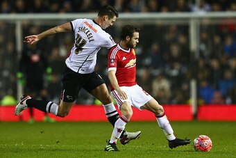 DERBY, ENGLAND - JANUARY 29:  Juan Mata of Manchester United holds off Jason Shackell of Derby County during the Emirates FA Cup fourth round match between Derby County and Manchester United at iPro Stadium on January 29, 2016 in Derby, England.  (Photo b