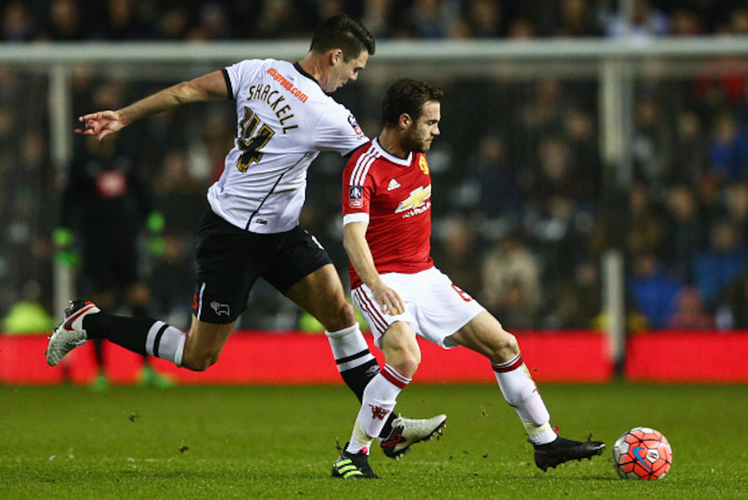 DERBY, ENGLAND - JANUARY 29:  Juan Mata of Manchester United holds off Jason Shackell of Derby County during the Emirates FA Cup fourth round match between Derby County and Manchester United at iPro Stadium on January 29, 2016 in Derby, England.  (Photo b