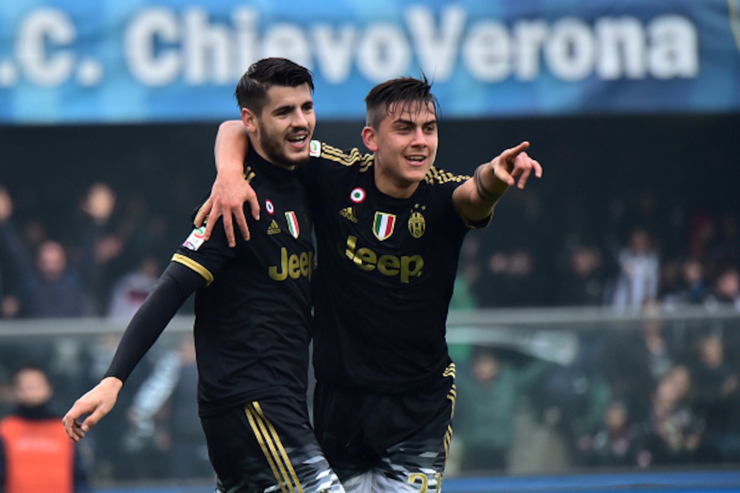 Juventus' forward from Spain Alvaro Morata (L) celebrates after scoring a goal with Juventus' forward from Argentina Paulo Dybala during the Serie A football match between Chievo Verona and Juventus on January 31, 2016 at Bentegodi Stadium in Verona.  / A