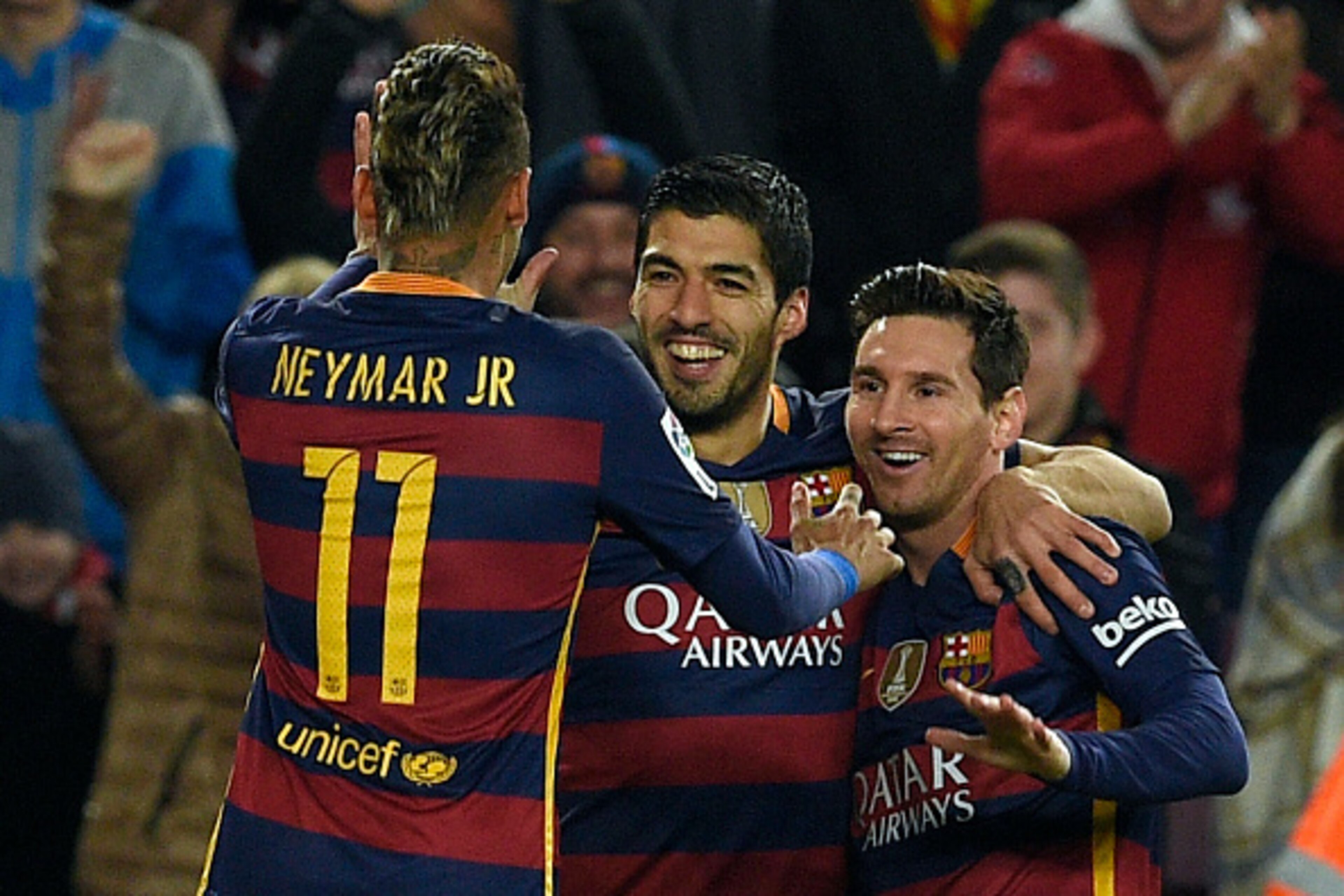 Barcelona's Uruguayan forward Luis Suarez (C) celebrates with Barcelona's Brazilian forward Neymar (L) and Barcelona's Argentinian forward Lionel Messi after scoring a goal during the Spanish Copa del Rey (King's Cup) semmi-finals first leg football match