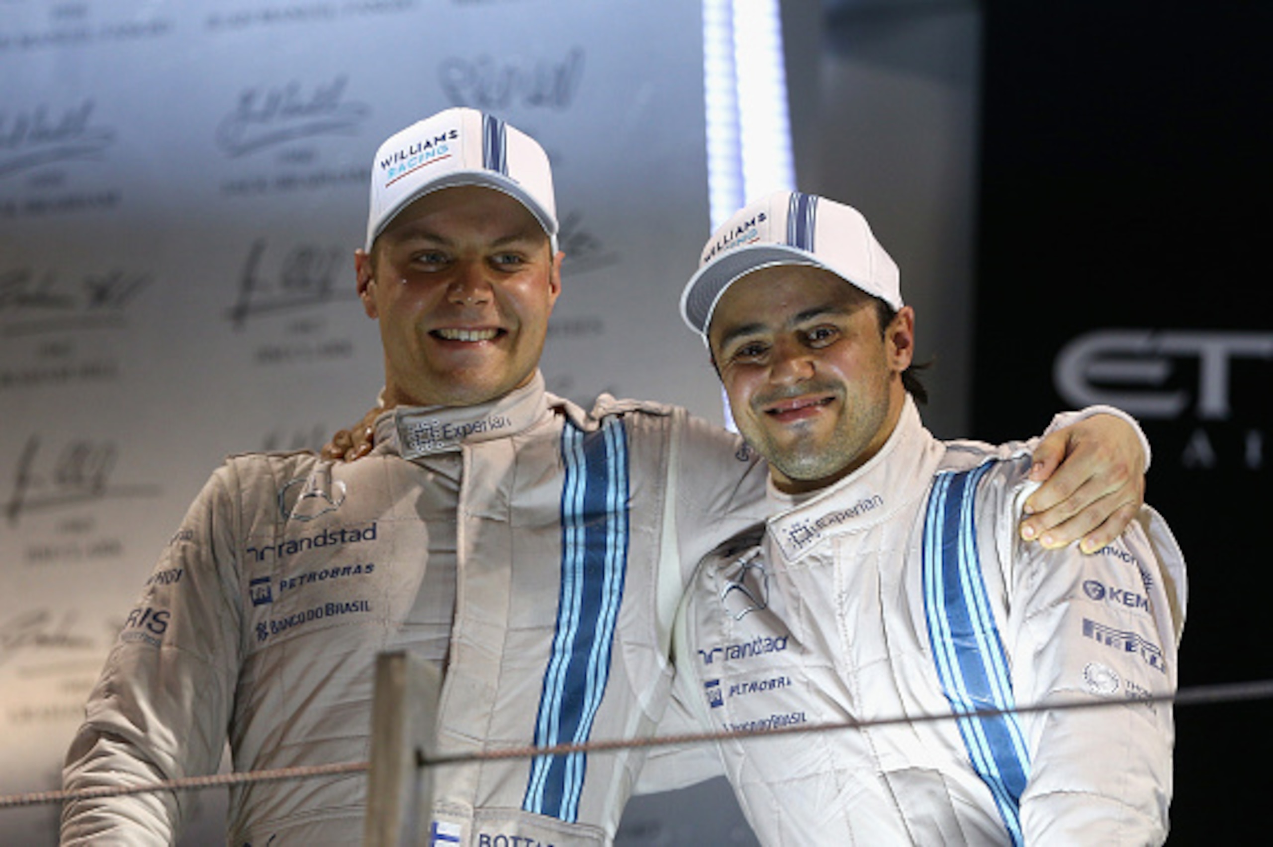 ABU DHABI, UNITED ARAB EMIRATES - NOVEMBER 23: Valtteri Bottas of Finland and Williams celebrates on the podium with Felipe Massa of Brazil and Williams after finisihing third and second respectively in the Abu Dhabi Formula One Grand Prix at Yas Marina ABU DHABI, UNITED ARAB EMIRATES - NOVEMBER 23: Valtteri Bottas of Finland and Williams celebrates on the podium with Felipe Massa of Brazil and Williams after finisihing third and second respectively in the Abu Dhabi Formula One Grand Prix at Yas Marina