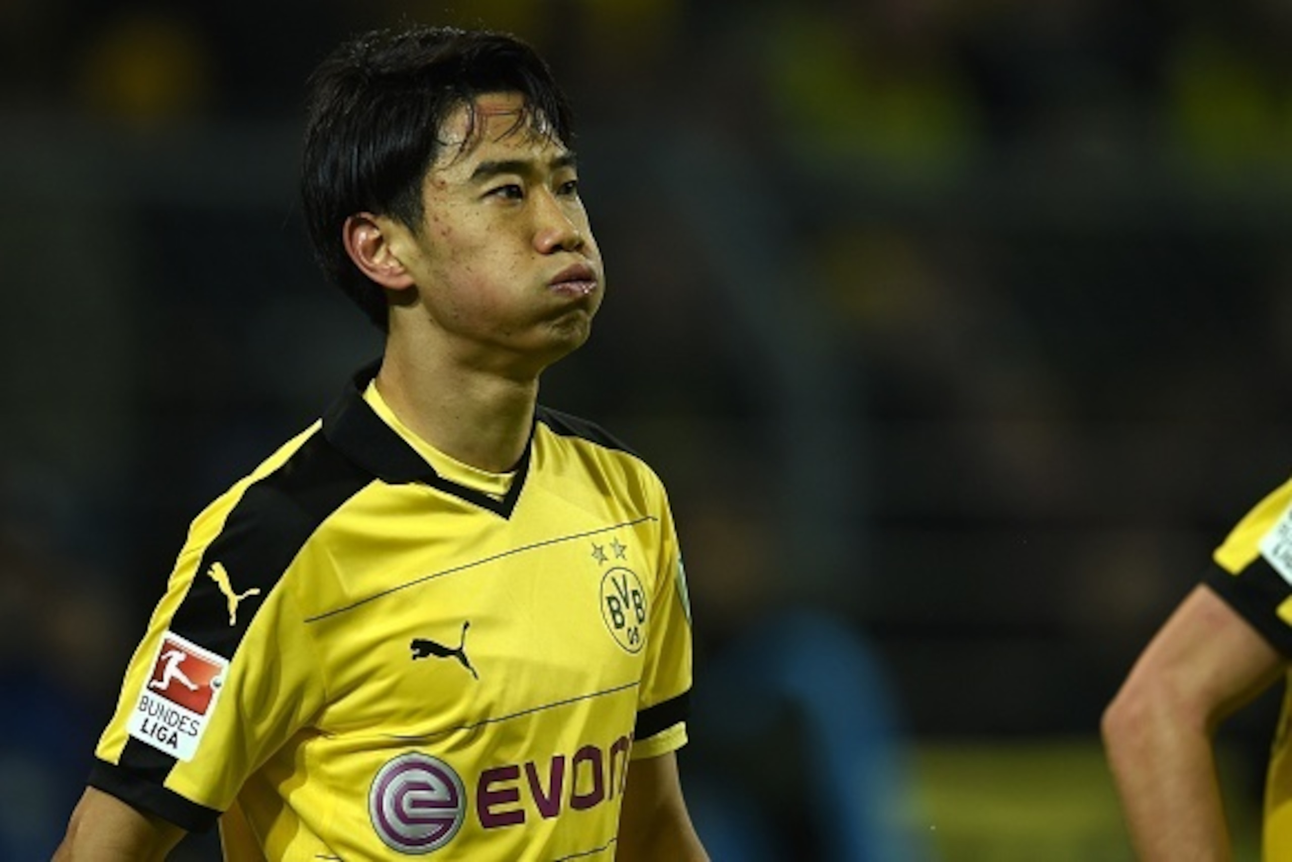 Dortmund's Japanese midfielder Shinji Kagawa reacts during the German first division Bundesliga football match Borussia Dortmund vs Eintracht Frankfurt in Dortmund, western Germany, on December 13, 2015. Dortmund won the match 4 - 1. AFP PHOTO / PATRIK ST Dortmund's Japanese midfielder Shinji Kagawa reacts during the German first division Bundesliga football match Borussia Dortmund vs Eintracht Frankfurt in Dortmund, western Germany, on December 13, 2015. Dortmund won the match 4 - 1. AFP PHOTO / PATRIK ST