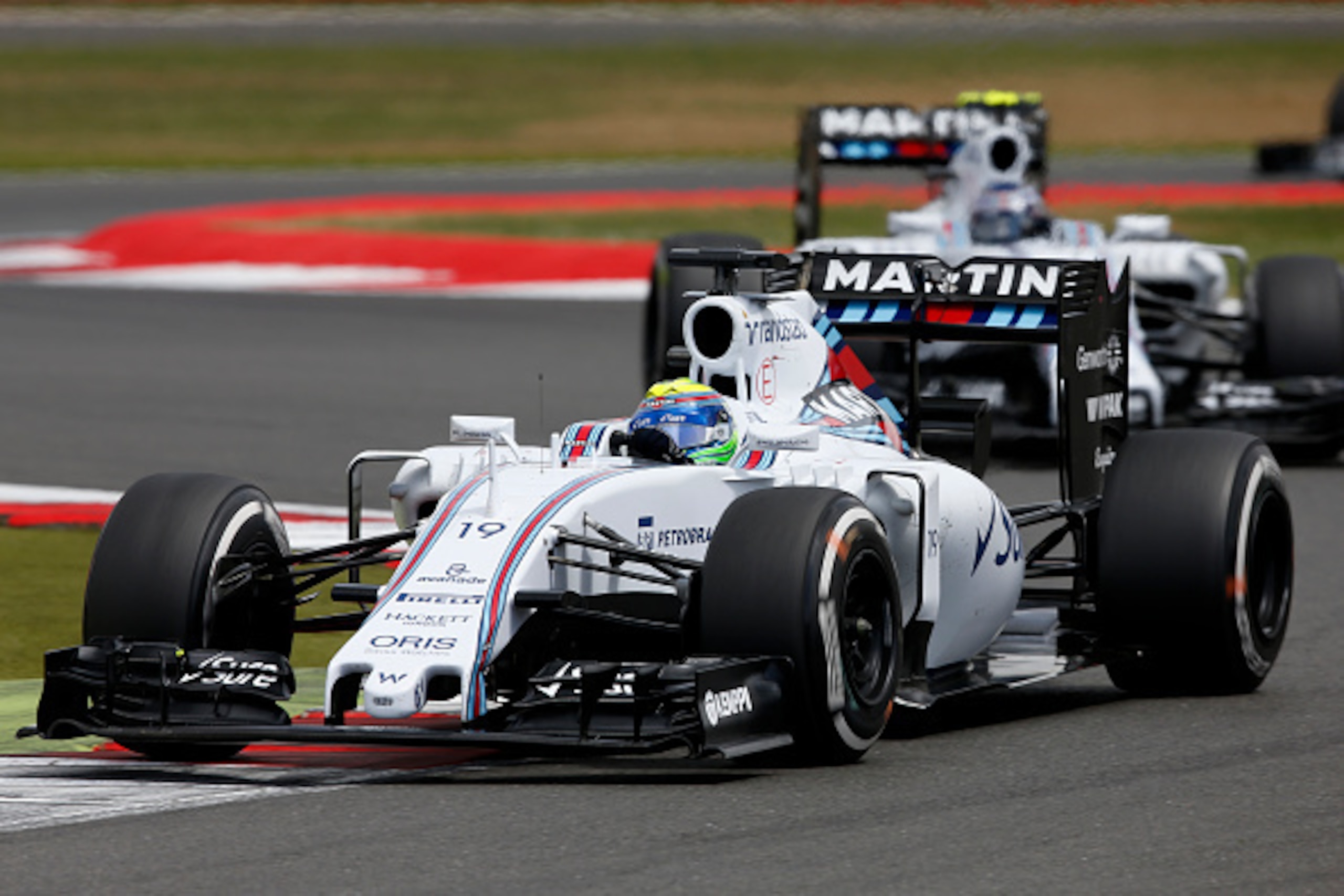 NORTHAMPTON, ENGLAND - JULY 05: Felipe Massa of Brazil and Williams drives ahead of Valtteri Bottas of Finland and Williams during the Formula One Grand Prix of Great Britain at Silverstone Circuit on July 5, 2015 in Northampton, England. (Photo by Char NORTHAMPTON, ENGLAND - JULY 05: Felipe Massa of Brazil and Williams drives ahead of Valtteri Bottas of Finland and Williams during the Formula One Grand Prix of Great Britain at Silverstone Circuit on July 5, 2015 in Northampton, England. (Photo by Char