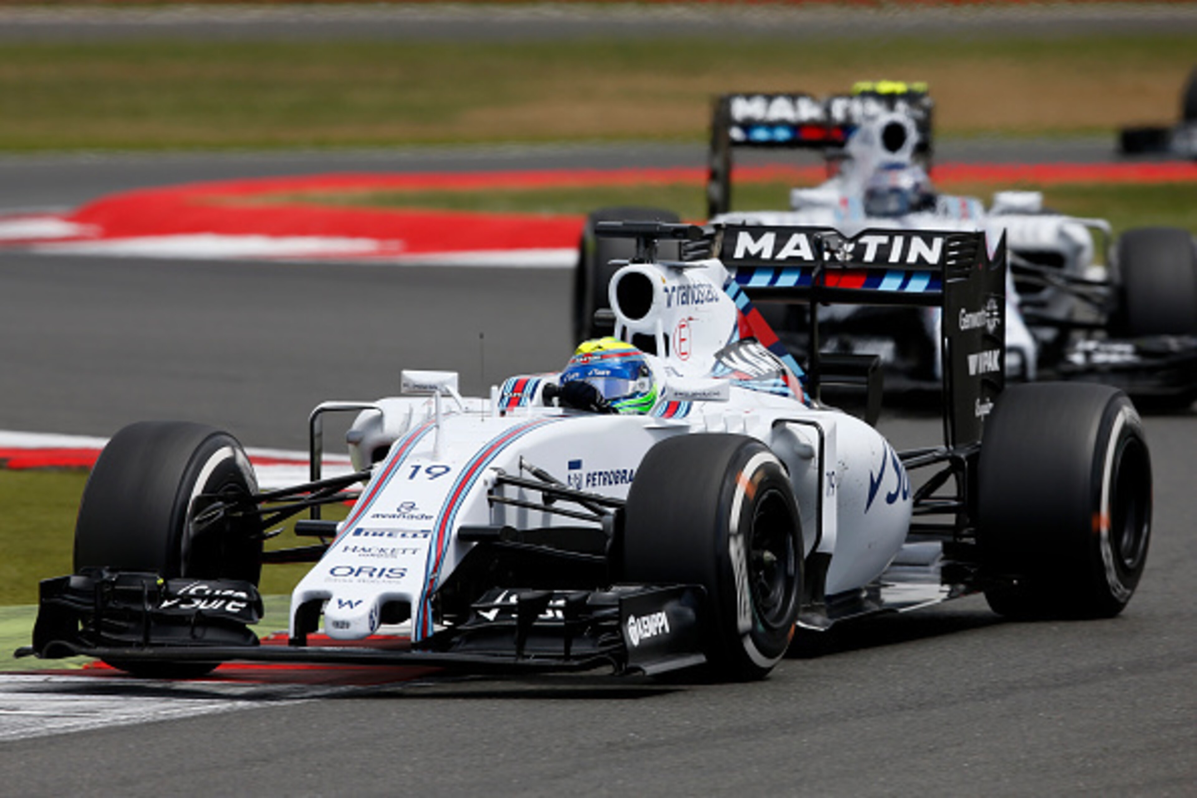 NORTHAMPTON, ENGLAND - JULY 05:  Felipe Massa of Brazil and Williams drives ahead of Valtteri Bottas of Finland and Williams during the Formula One Grand Prix of Great Britain at Silverstone Circuit on July 5, 2015 in Northampton, England.  (Photo by Char