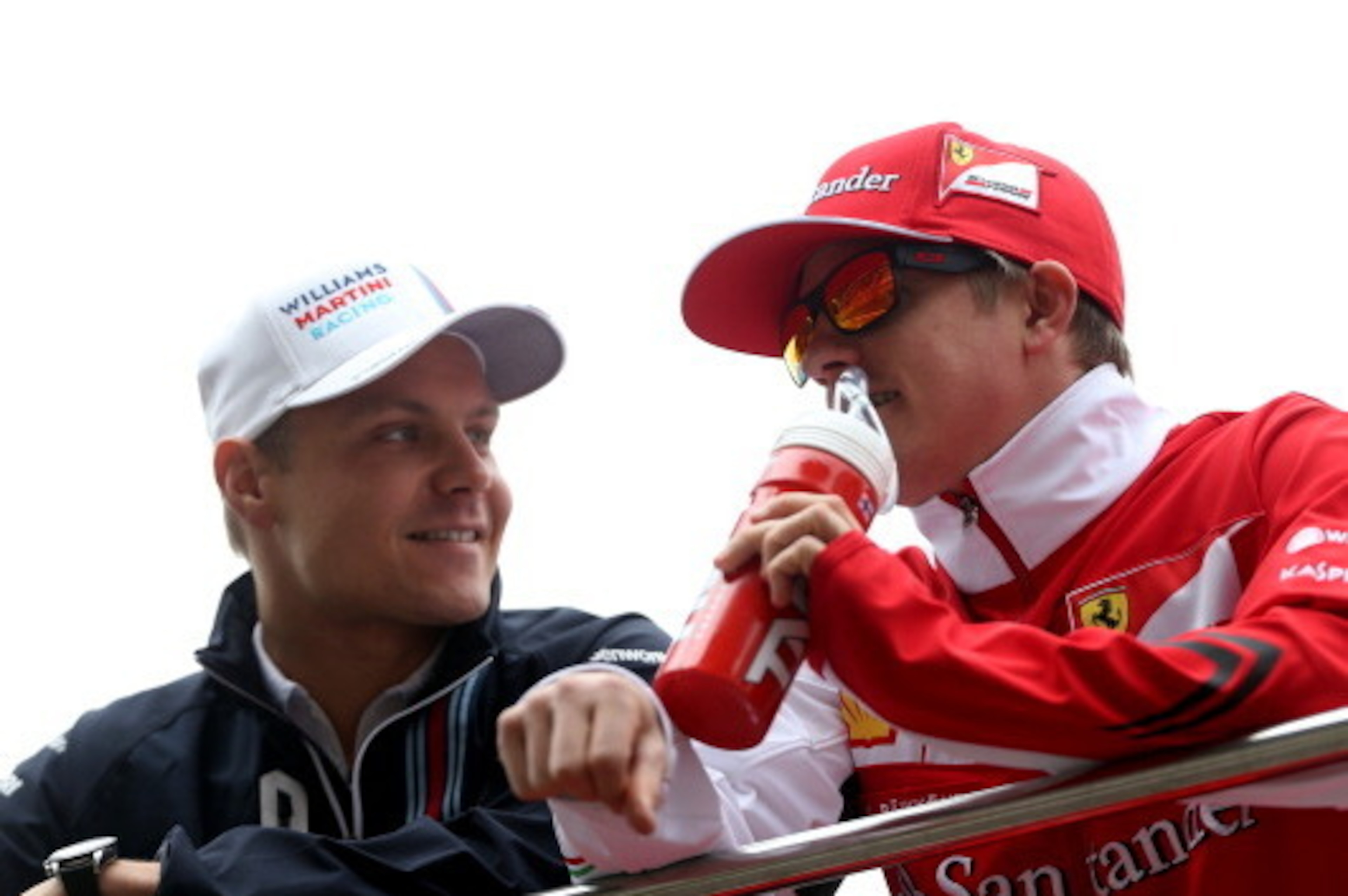 SHANGHAI, CHINA - APRIL 20:  Valtteri Bottas of Finland and Williams and Kimi Raikkonen of Finland and Ferrari take part in the drivers parade prior to the Chinese Formula One Grand Prix at the Shanghai International Circuit on April 20, 2014 in Shanghai,