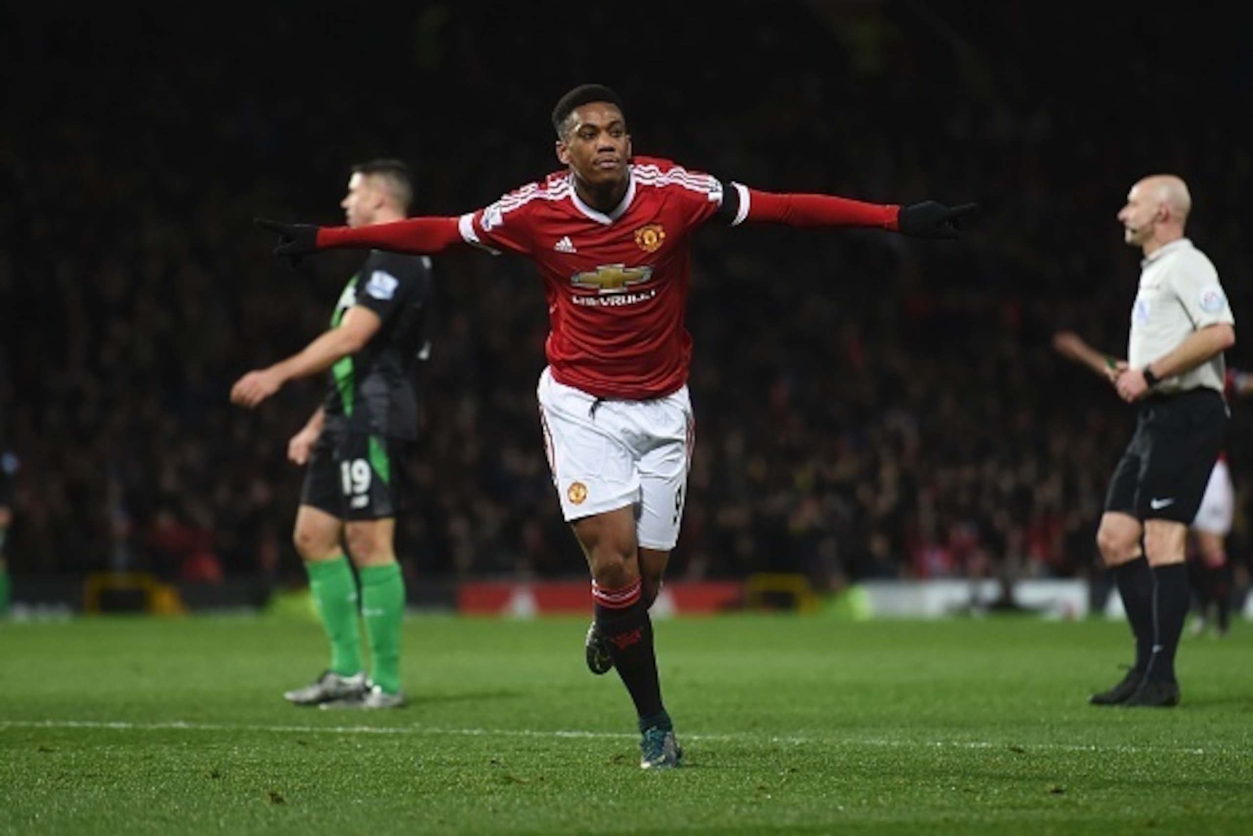 Manchester United's French striker Anthony Martial celebrates scoring their second goal during the English Premier League football match between Manchester United and Stoke City at Old Trafford in Manchester, north west England, on February 2, 2016. / AFP