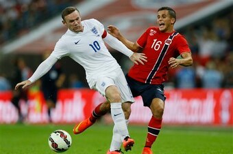 Elabdellaoui (right) challenges England and Manchester United captain Wayne Rooney (left).