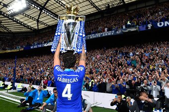 LONDON, ENGLAND - MAY 24:  Cesc Fabregas of Chelsea celebrates with the trophy after the Barclays Premier League match between Chelsea and Sunderland at Stamford Bridge on May 24, 2015 in London, England. Chelsea were crowned Premier League champions.  (P