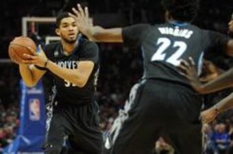 February 3, 2016; Los Angeles, CA, USA; Minnesota Timberwolves center Karl-Anthony Towns (32) passes the ball to guard Andrew Wiggins (22) against Los Angeles Clippers during the first half at Staples Center. Mandatory Credit: Gary A. Vasquez-USA TODAY Sp