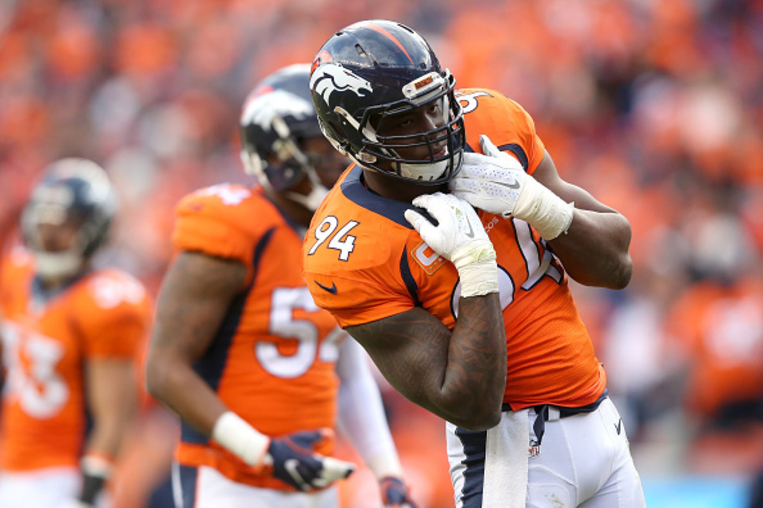 DENVER, CO - JANUARY 24:  DeMarcus Ware #94 of the Denver Broncos reacts after a play in the second half against the New England Patriots in the AFC Championship game at Sports Authority Field at Mile High on January 24, 2016 in Denver, Colorado.  (Photo 