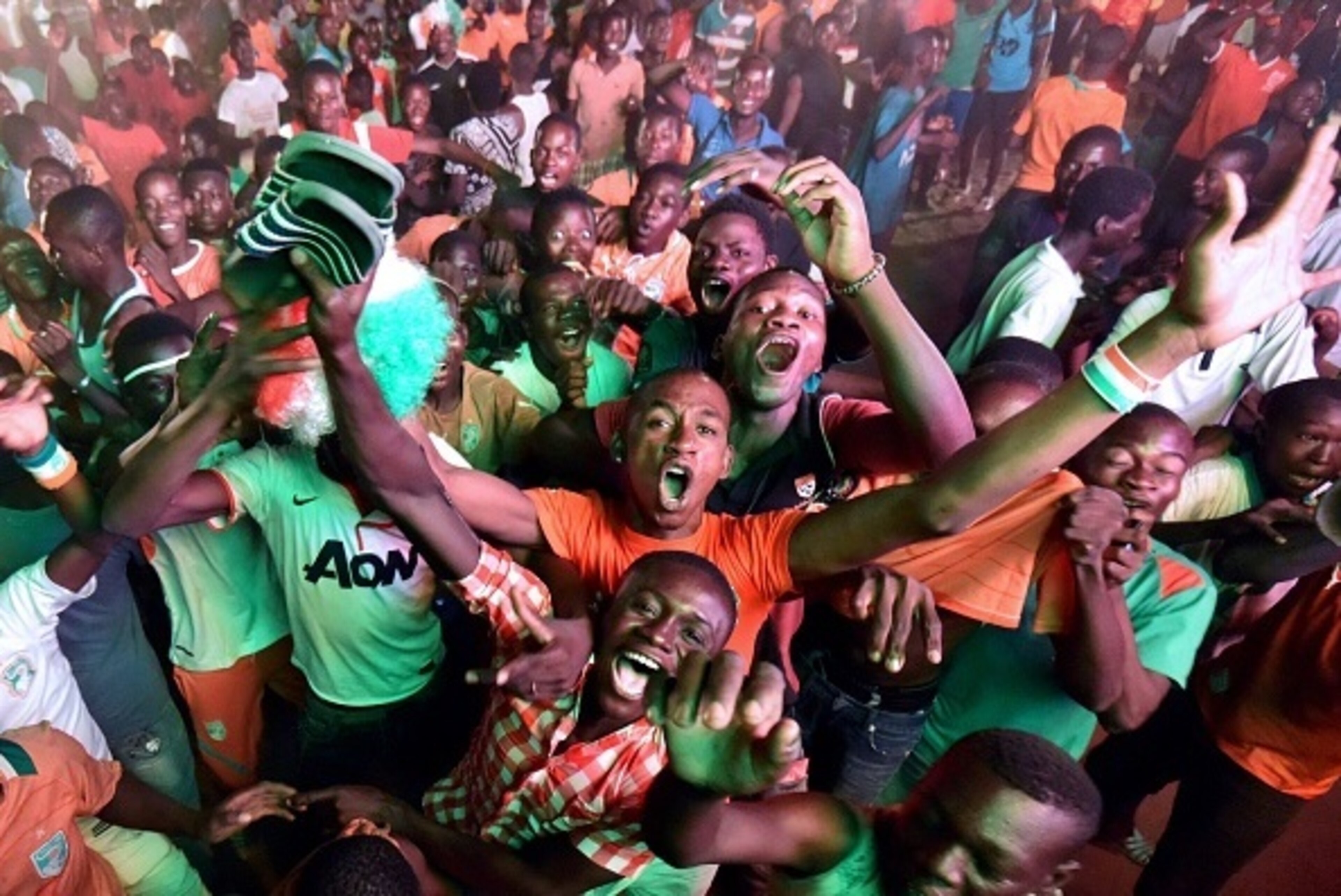 Ivory Coast's supporters celebrate in Abidjan on February 4, 2015 after Ivory Coast won the 2015 Africa Cup of Nations semi-final football match against Democratic Republic of Congo. Ivory Coast won 3-1 in Bata. AFP PHOTO / SIA KAMBOU (Photo credit Ivory Coast's supporters celebrate in Abidjan on February 4, 2015 after Ivory Coast won the 2015 Africa Cup of Nations semi-final football match against Democratic Republic of Congo. Ivory Coast won 3-1 in Bata. AFP PHOTO / SIA KAMBOU (Photo credit