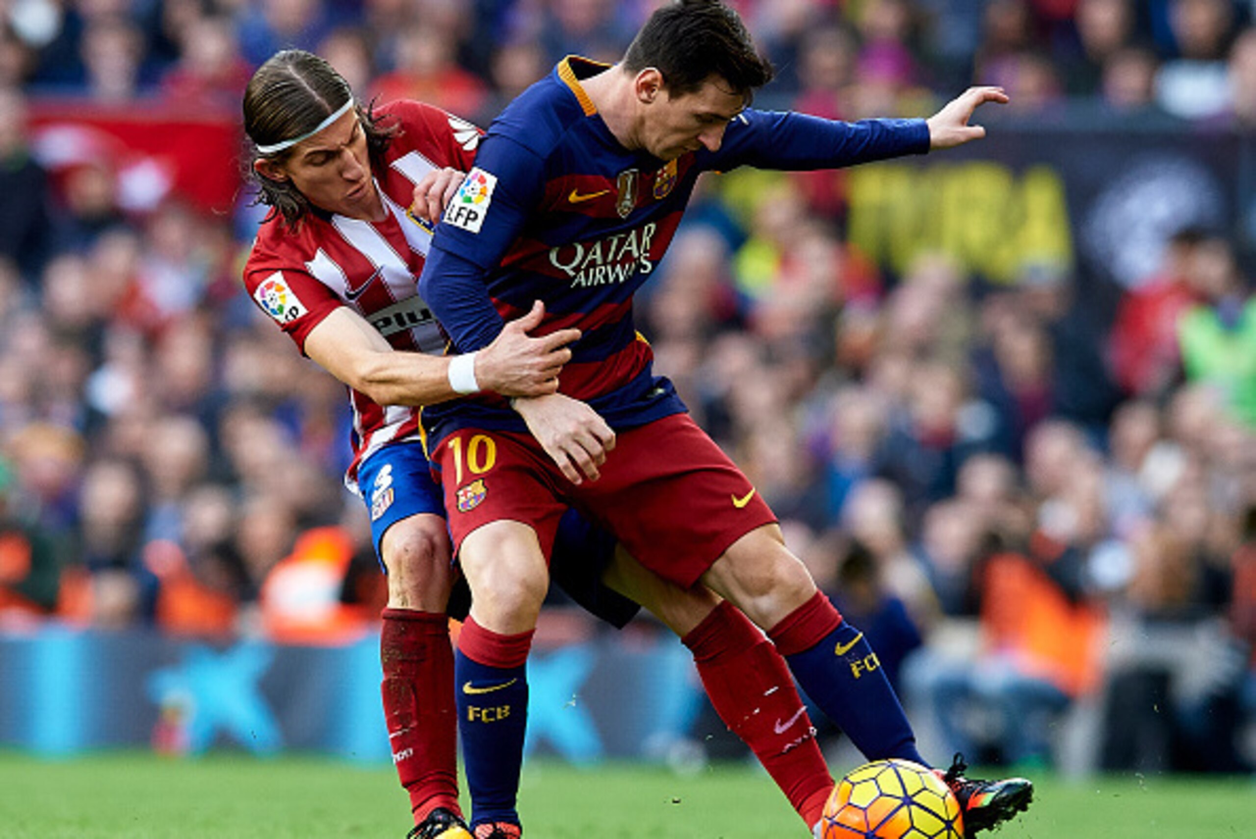 BARCELONA, SPAIN - JANUARY 30:  Lionel Messi (10) of Barcelona competes for the ball with Filipe Luis of Atletico de Madrid during the La Liga match between FC Barcelona and Atletico de Madrid at Camp Nou on January 30, 2016 in Barcelona, Spain.  (Photo b