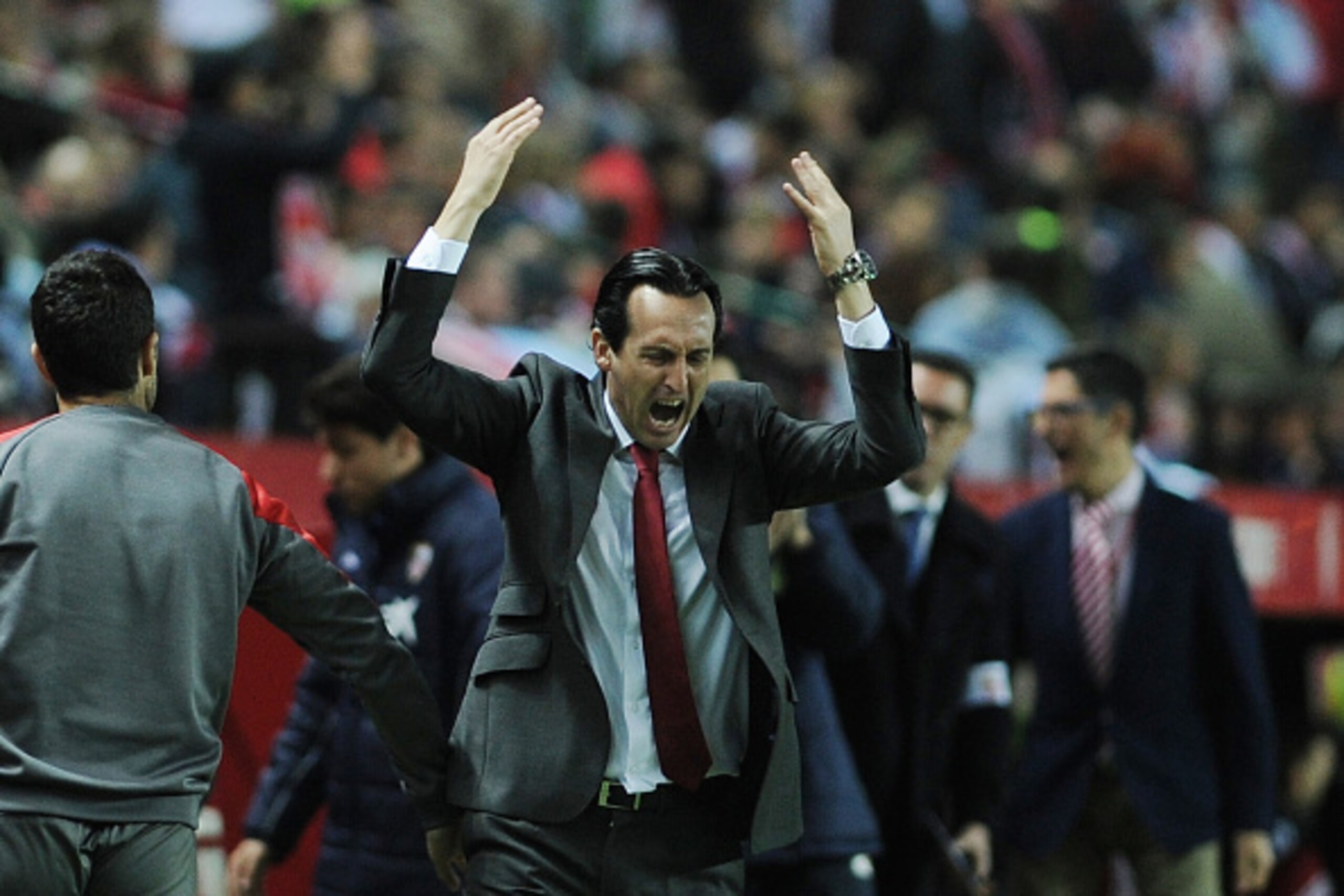Sevilla's coach Unai Emery (C) gestures after a failed attemp to goal during the Spanish Copa del Rey (King's Cup) semifinal first leg football match Sevilla FC vs RC Celta de Vigo at the Ramon Sanchez Pizjuan stadium in Sevilla on February 4, 2016.   AFP